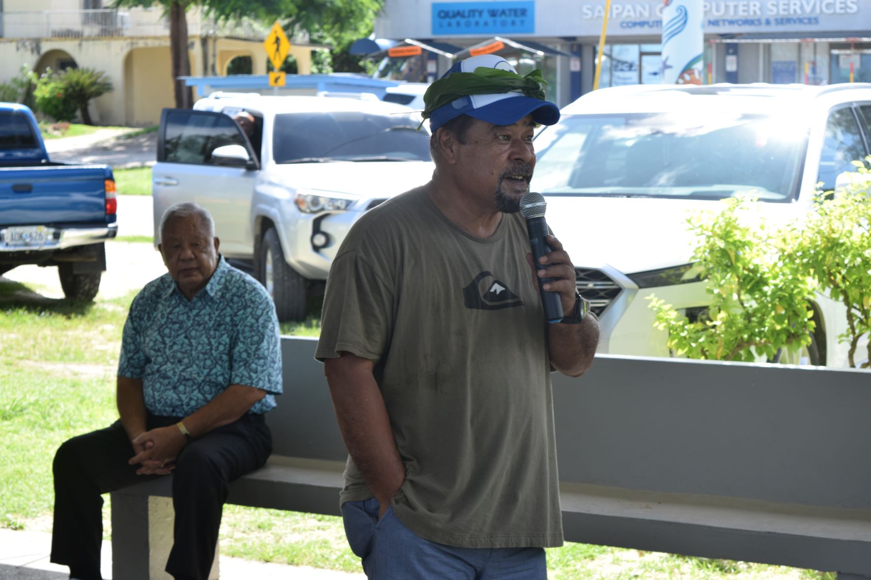 Refaluwasch for Good Governance President Felix Nogis speaks as independent candidate for lt. governor, Saipan Mayor David Apatang, listens during a gathering at the 13 Fishermen Pavilion on Saturday to endorse the AD 2022 team.