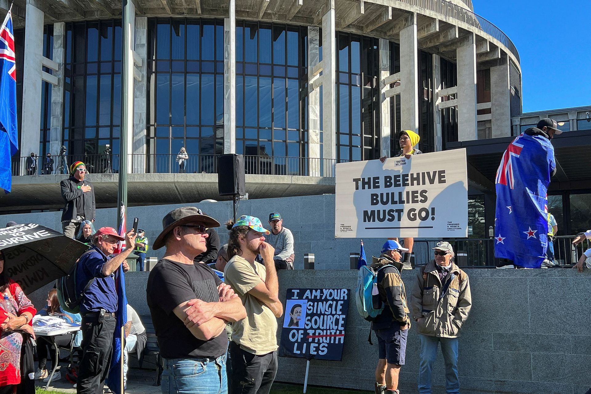 Protesters gather on the grounds of New Zealand Parliament, as they demonstrate against what they consider as government encroachment on freedoms, in Wellington, New Zealand, Aug. 23, 2022.
