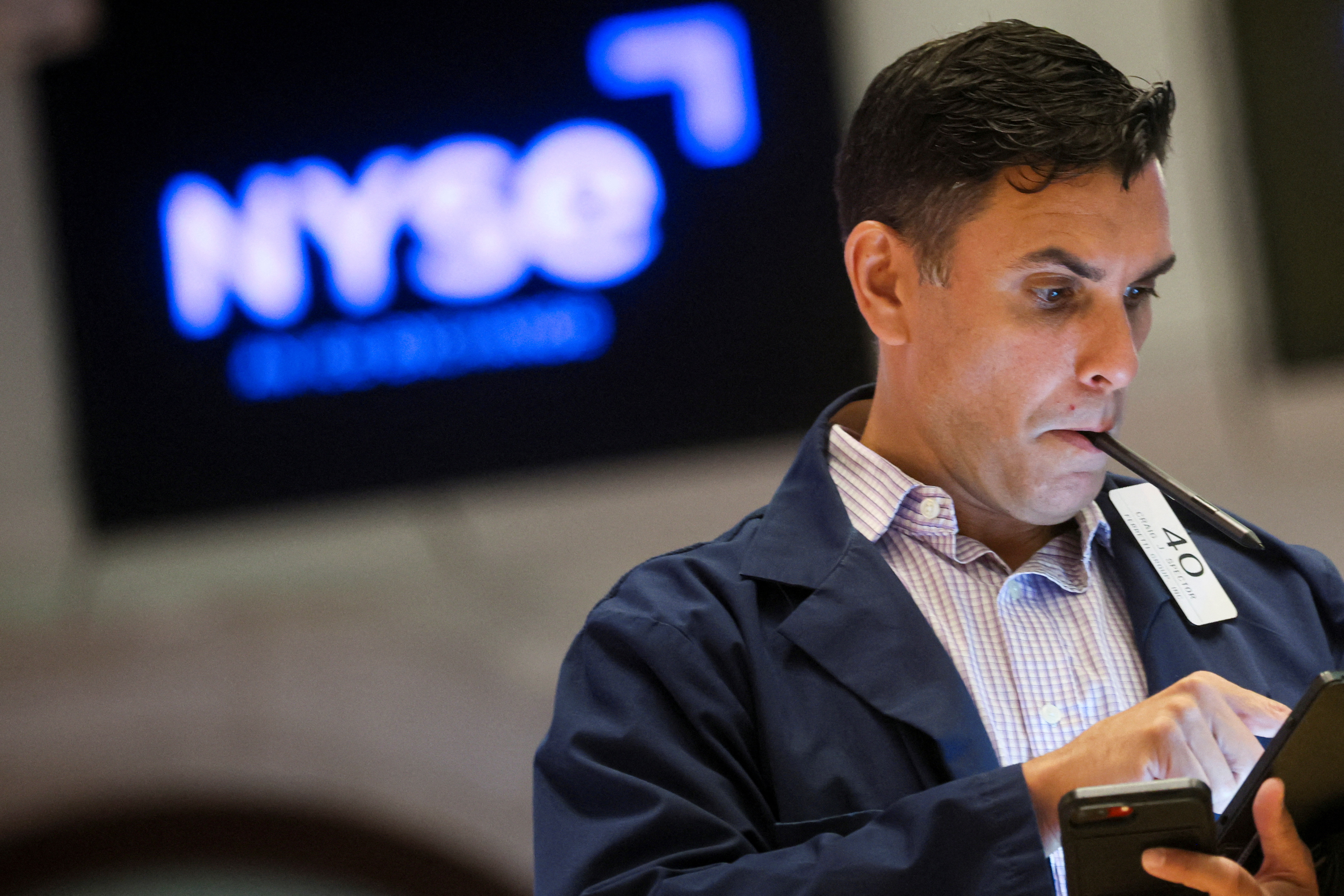 A trader works on the floor of the New York Stock Exchange in New York City, Aug. 17, 2022.