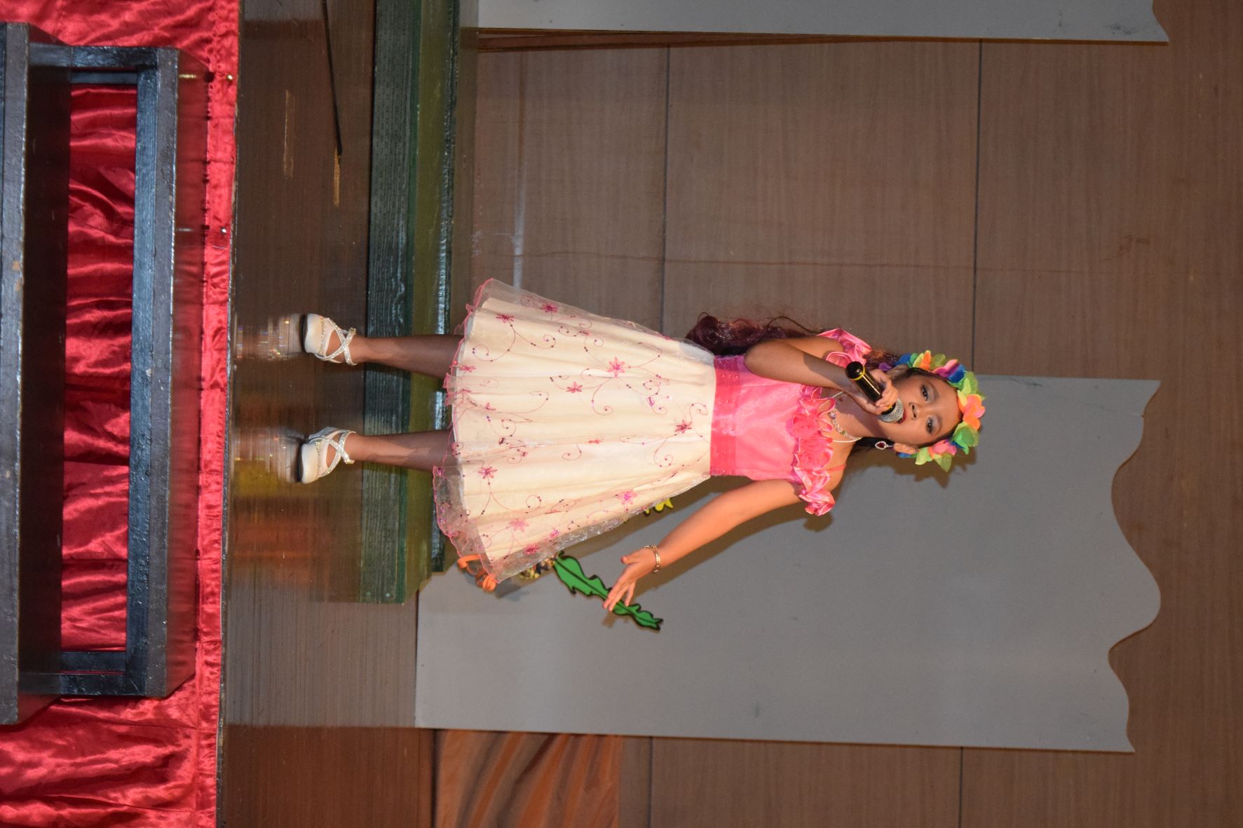 Third grader Roanne Palma, as Ariel, performs a song number.