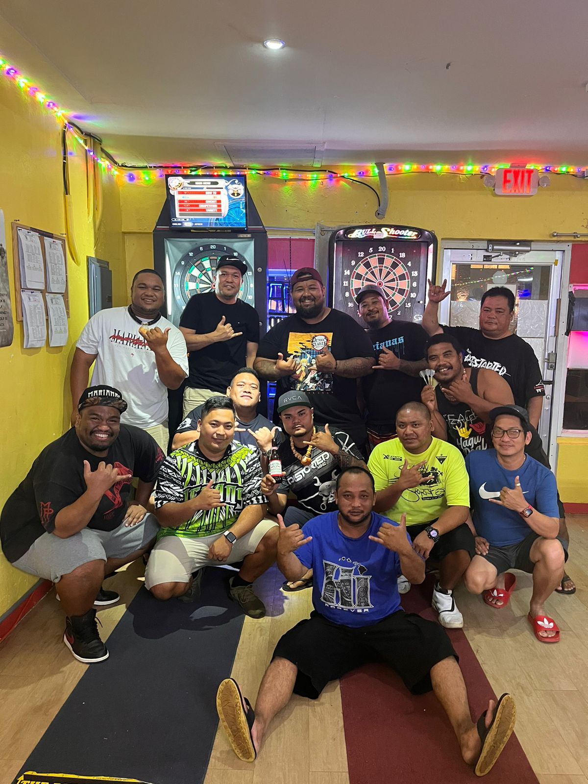 The 6JMS Drunken Dragons and Tambayan Distorted pose for a photo after their match in the “A” Division of the SEDA Bud Light Dart League Monday at Tambayan Bar.