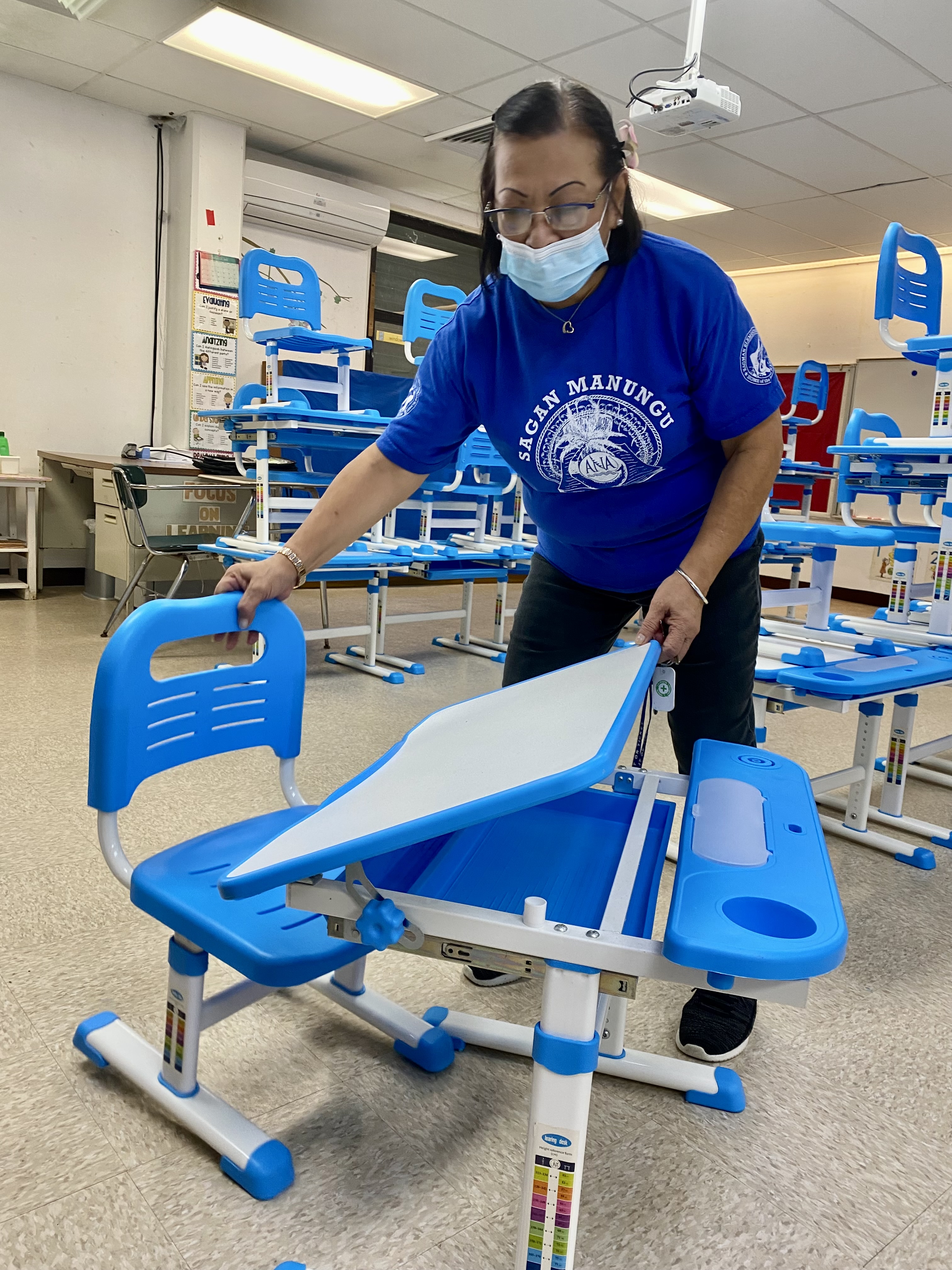 Kagman Elementary School Principal Dr. Ignacia  Demapan shows the brand new, age-appropriate and student-safe-and-friendly classroom furniture that will be used by the 20 public elementary, middle and high schools when the new school year opens on Aug.  22.