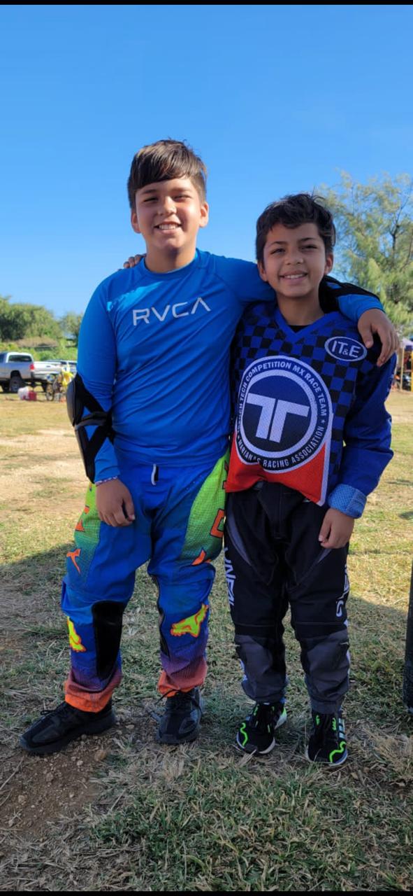 Brothers Stanley Jr. and Conan Iakopo pose for a photo before competing in the Monster Energy Points Race Series at Cow Town Raceway Park.