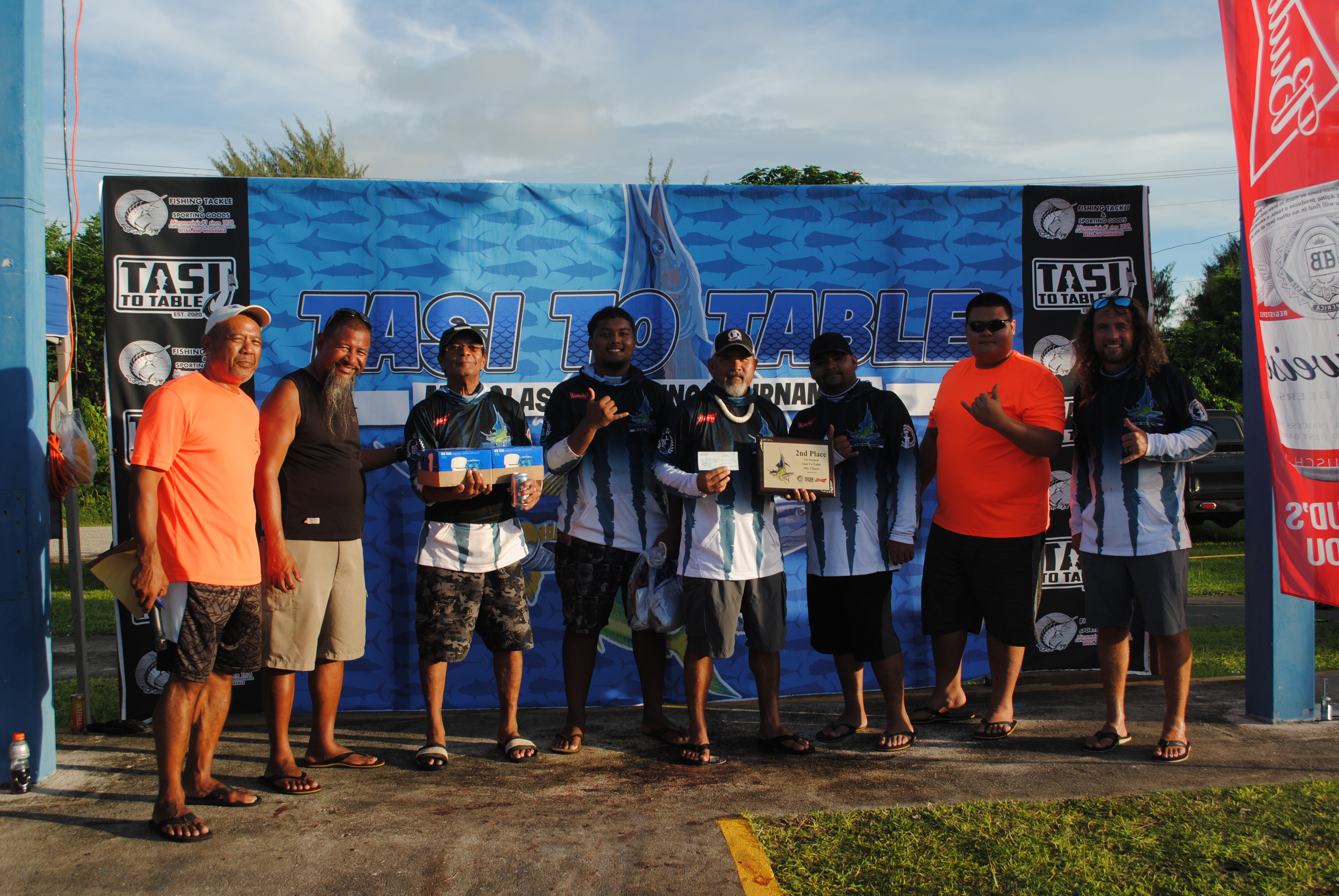 The crew of Little Missy, which finished second, poses  for a photo with Tasi To Table officials at the conclusion of the 1st Annual Mix Classic on Saturday at Smiling Cove Marina.