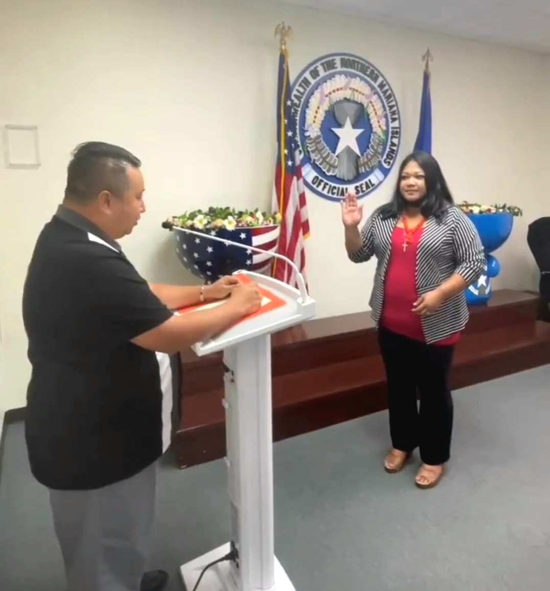 Carla N. Camacho is sworn in by Gov. Ralph DLG Torres in the governor's conference room on Tuesday.
