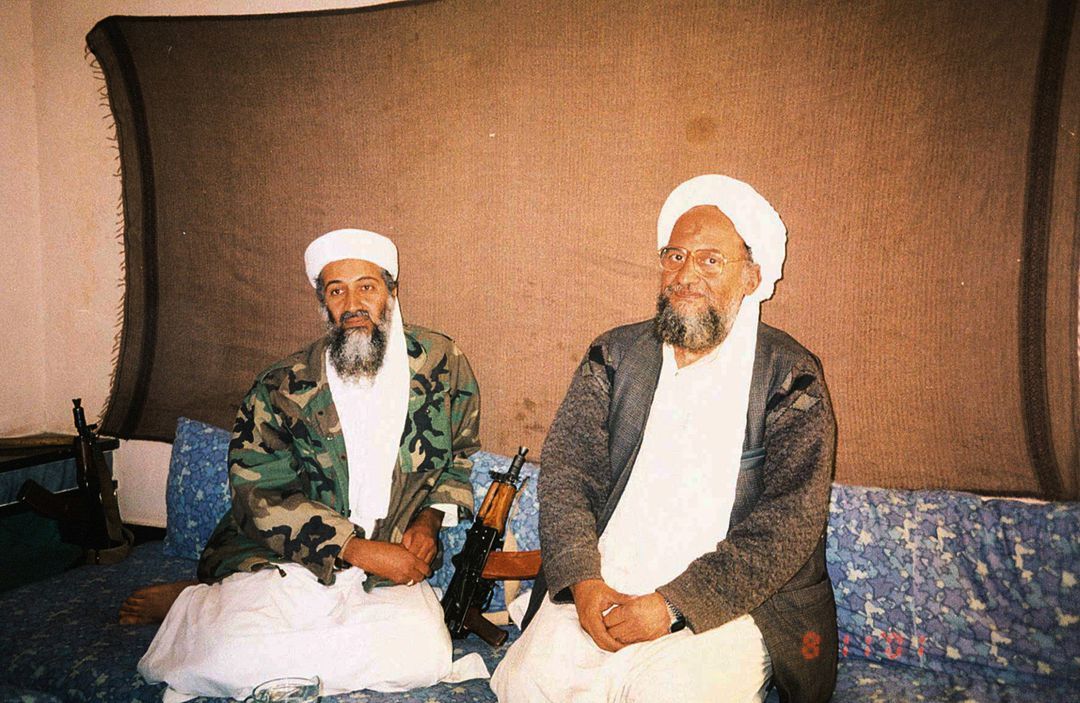 Osama bin Laden sits with his adviser Ayman al-Zawahiri, an Egyptian linked to the al Qaeda network, during an interview with Pakistani journalist Hamid Mir — not pictured — in an image supplied by Dawn newspaper, Nov. 10, 2001.