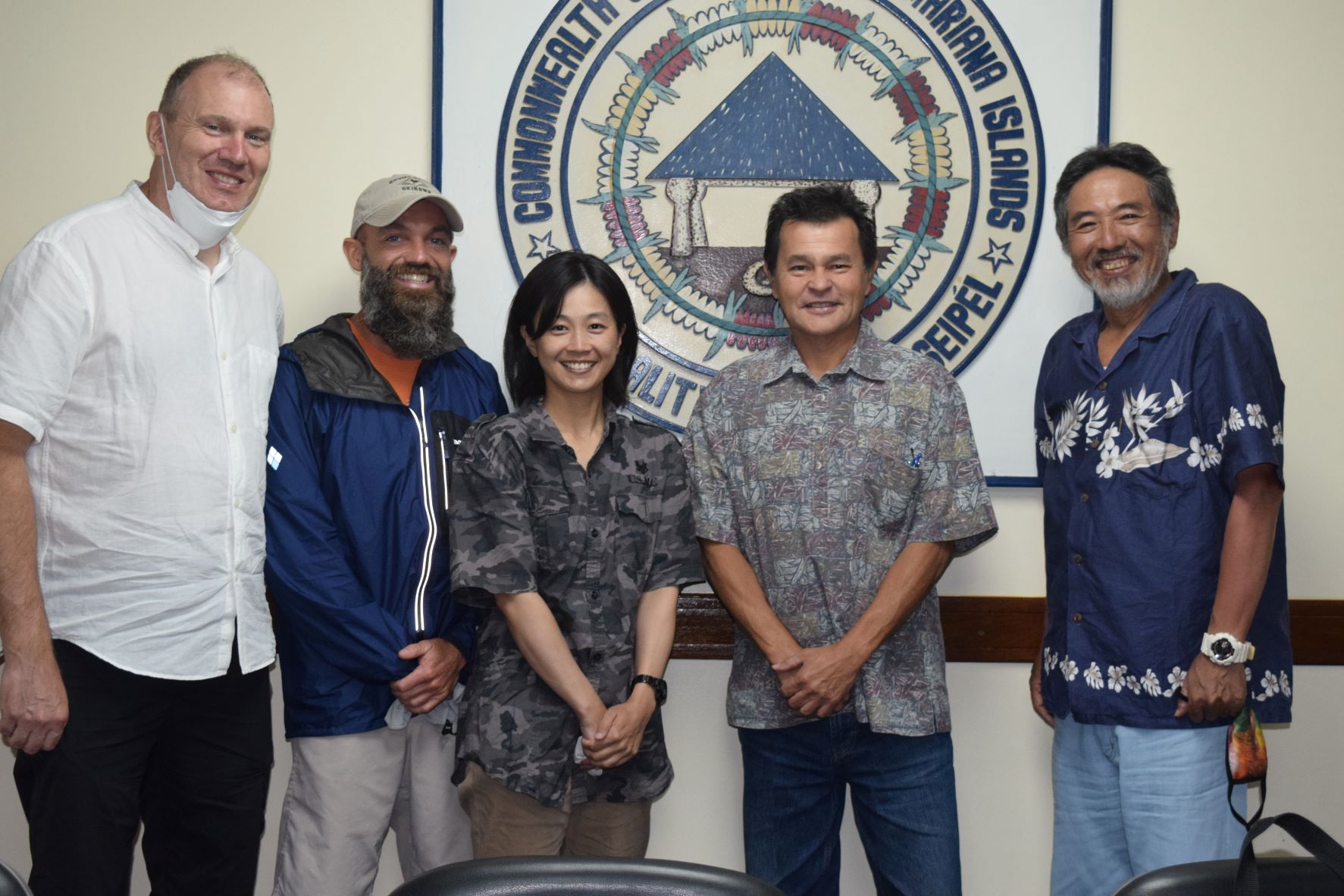 Kuentai-USA Chairman Usan Kurata, right, Secretary General Yukari Akatsuka, center, archeologist Danny Keay, left, and Kuentai-U.S.A. member Matt Small, second left, pose for a photo with the special assistant to the Saipan mayor, Henry Hofschneider, during a visit at the mayor’s office on Tuesday.