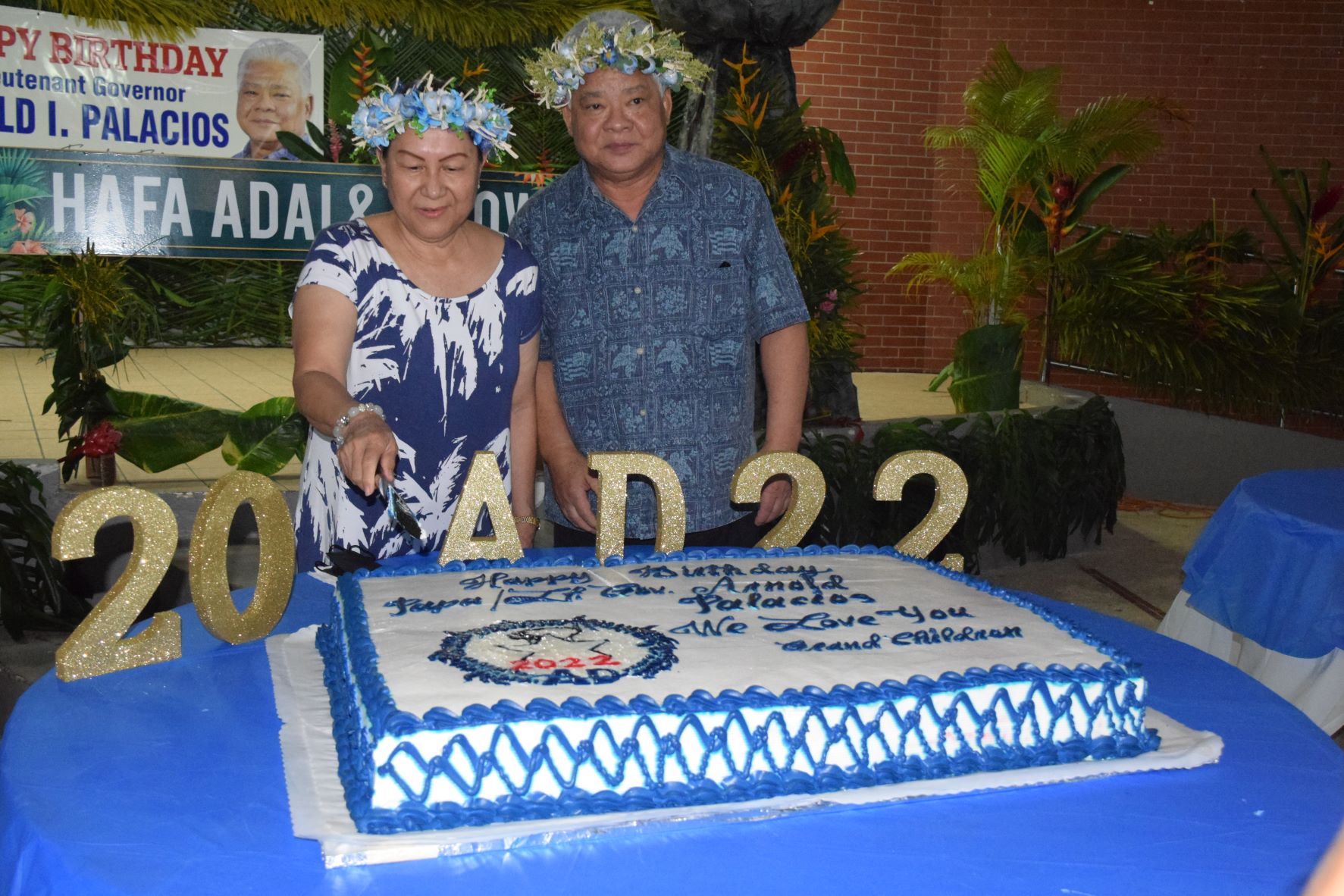 Second lady Wella Palacios cuts the birthday cake for independent gubernatorial candidate Lt. Gov. Arnold I. Palacios who celebrated his 67th birthday on Friday at Garapan Central Park.