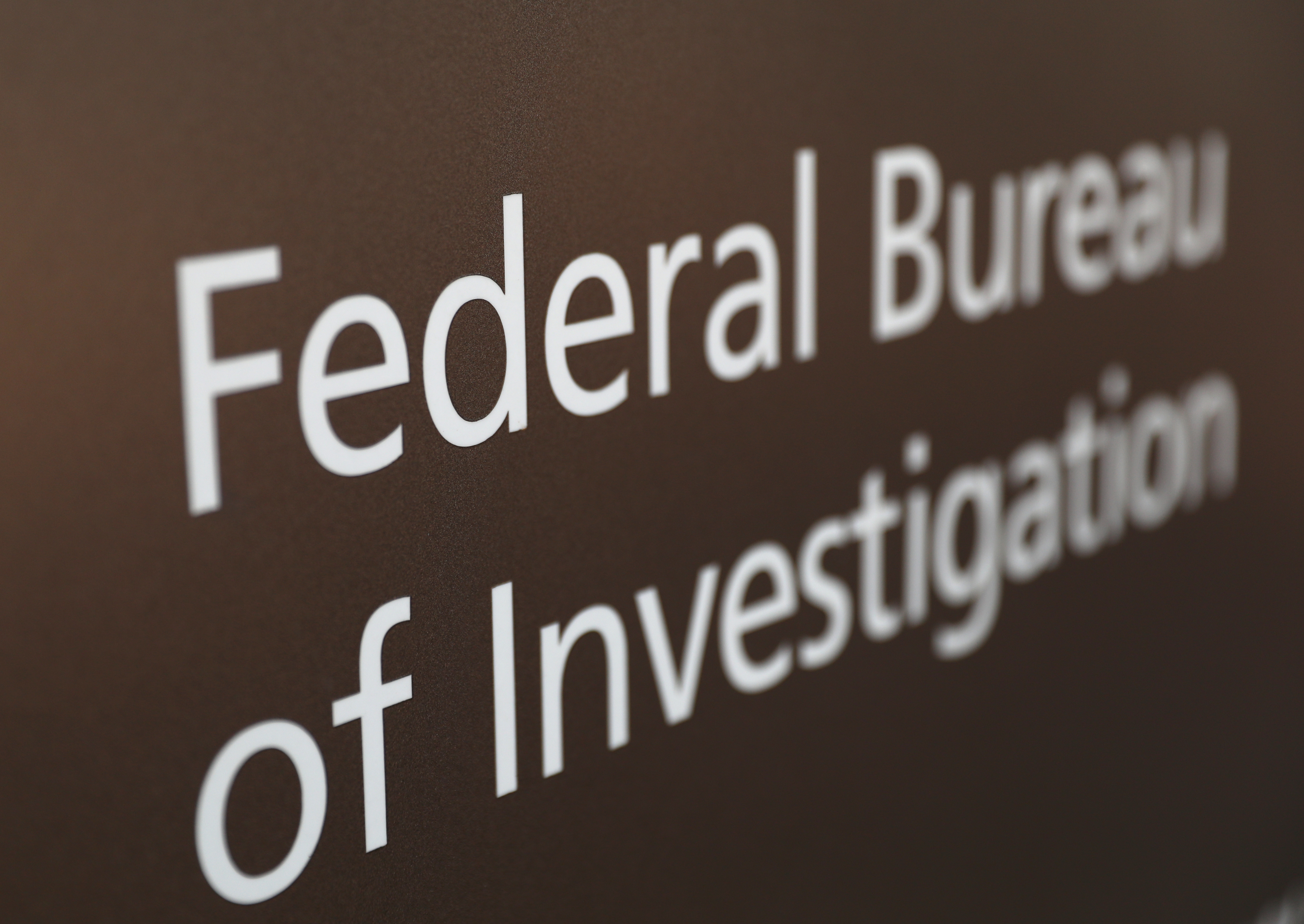 A sign of the Federal Bureau of Investigation seen outside of the J. Edgar Hoover FBI Building in Washington, D.C., March 12, 2019. 