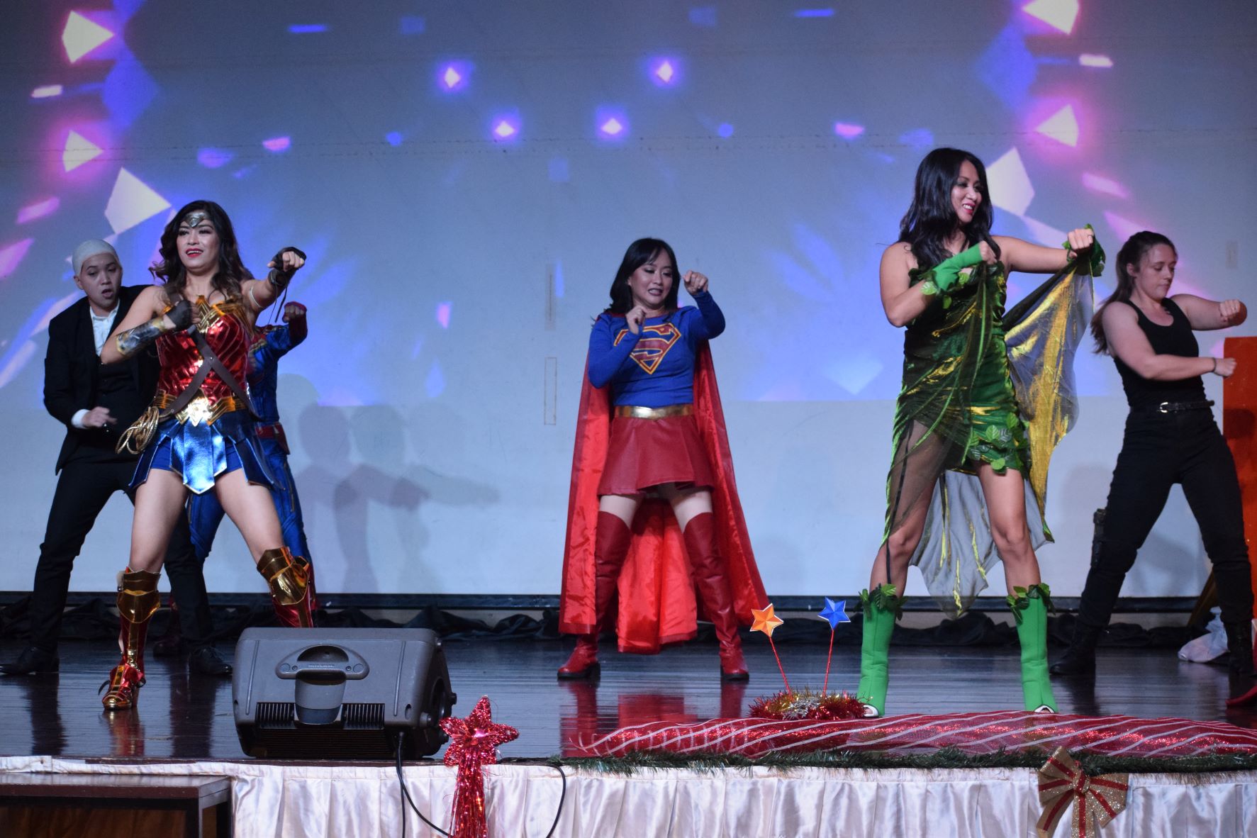 M2 Fitness President Mary Grace Bautista, second, left and other members perform a dance number during their Christmas party in December at the Saipan World Resort Royal.