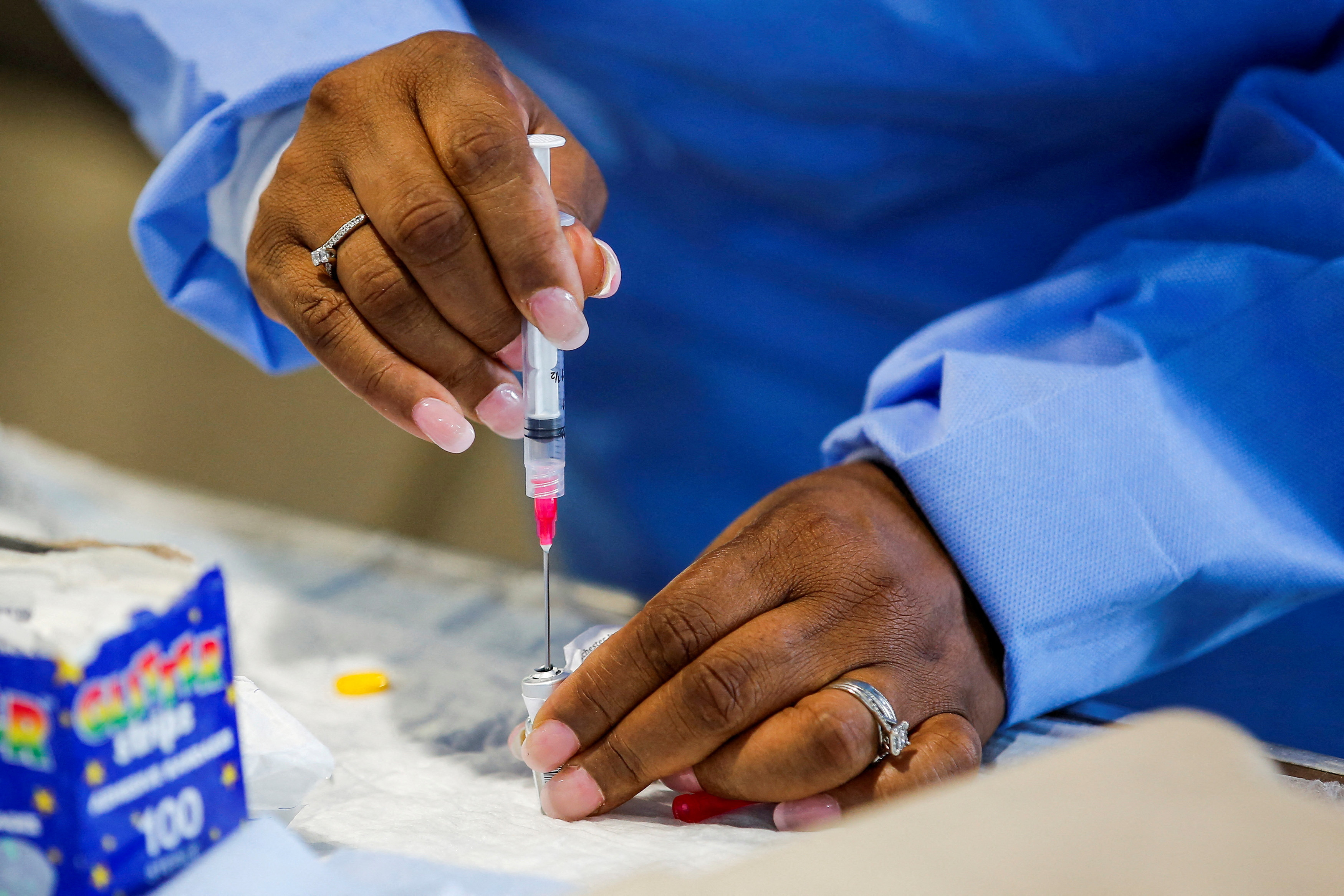 A staff member of the Westchester Medical Center prepares a monkeypox vaccine in a drive-through monkeypox vaccination point at the Westchester Medical Center in Valhalla, New York, July 28, 2022.