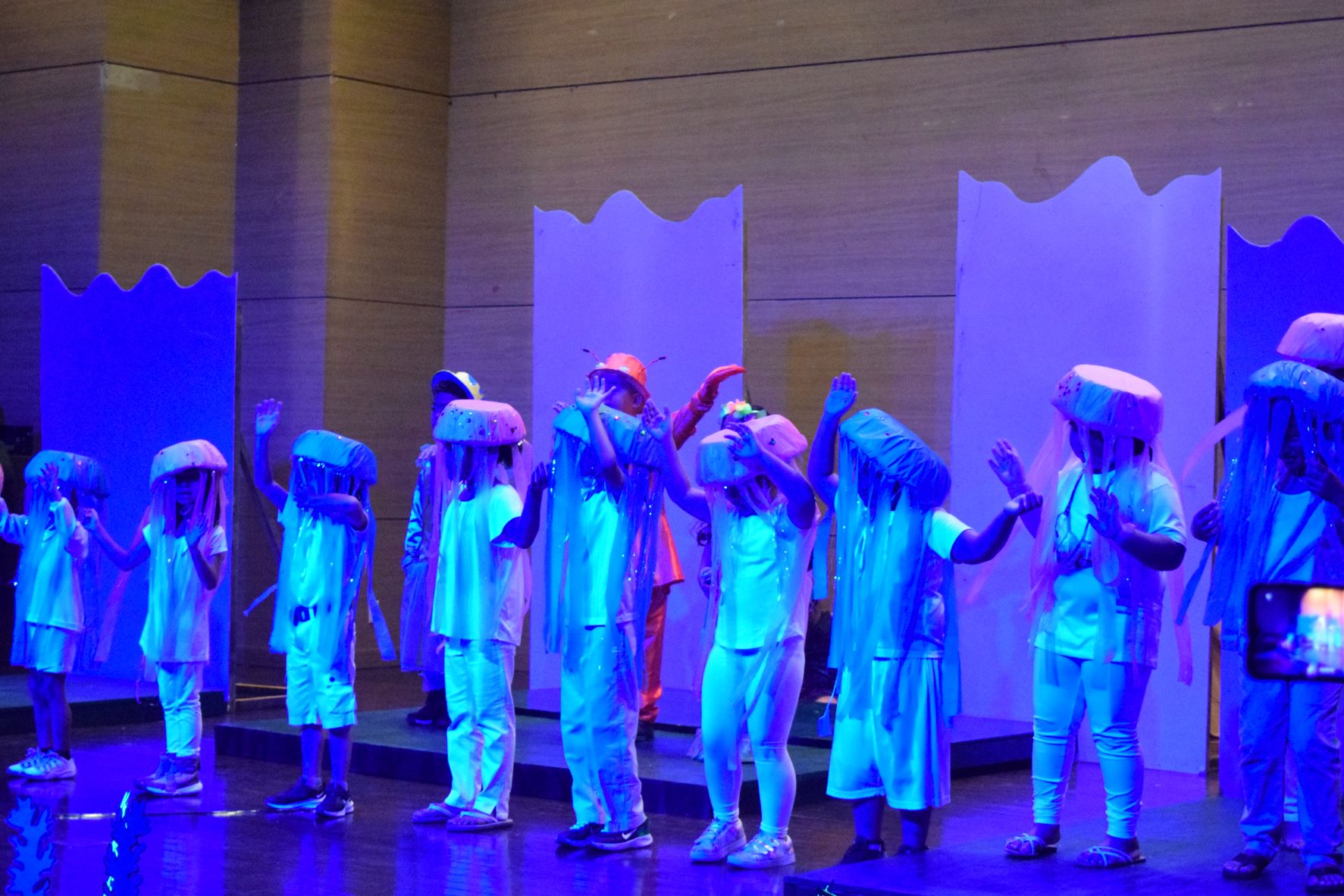 The jelly fish as portrayed by third graders perform a dance number with Flounder played by Benjie Escano Jr. and Sebastian played by Leyland Duenas in “The Little Mermaid Jr.” during the Green Meadow School Summer Camp presentation at Saipan World Resort on Monday.