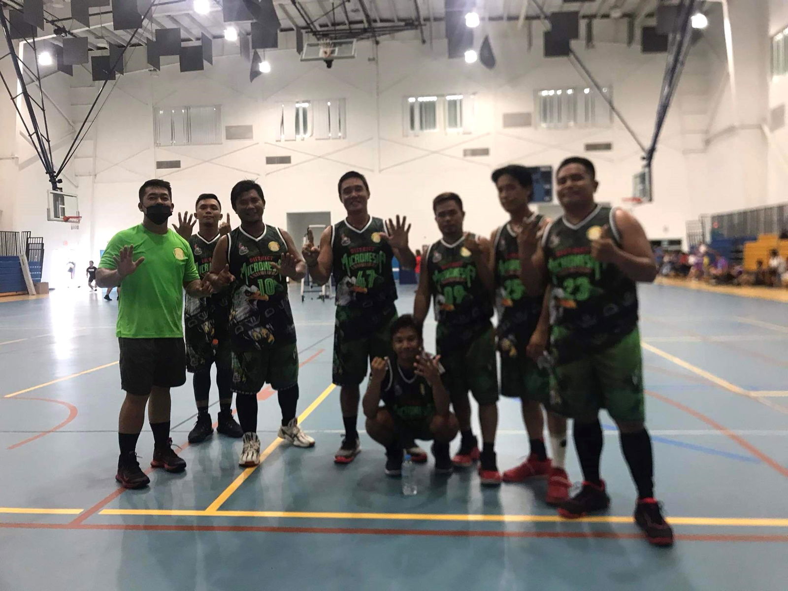 Team Green player pose for a photo after their sixth victory in the 2022 Church of Christ Unity Games Sunday at the MHS gym.
