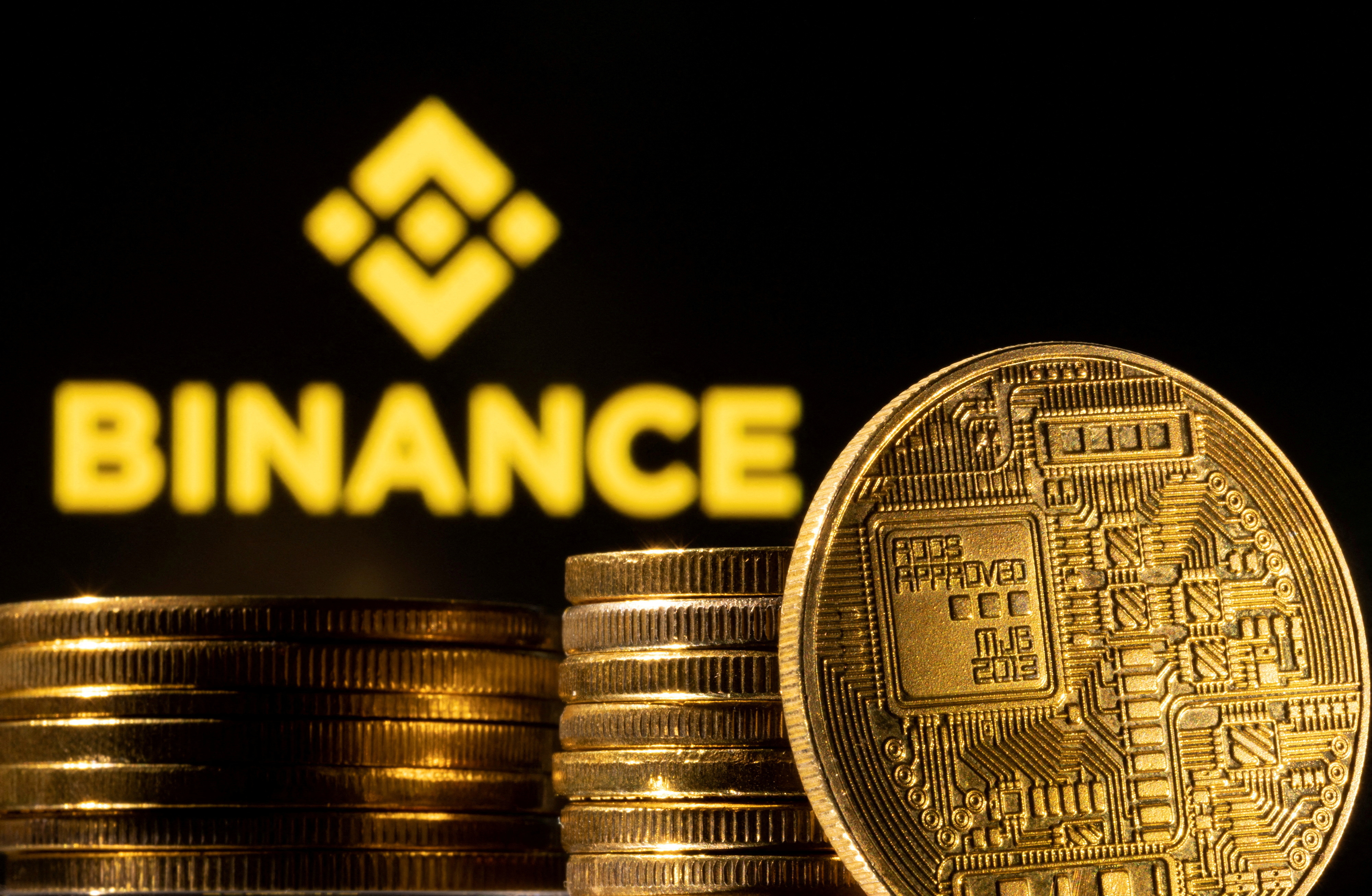 A representation of cryptocurrency is seen in front of Binance logo in this illustration taken on March 4, 2022.