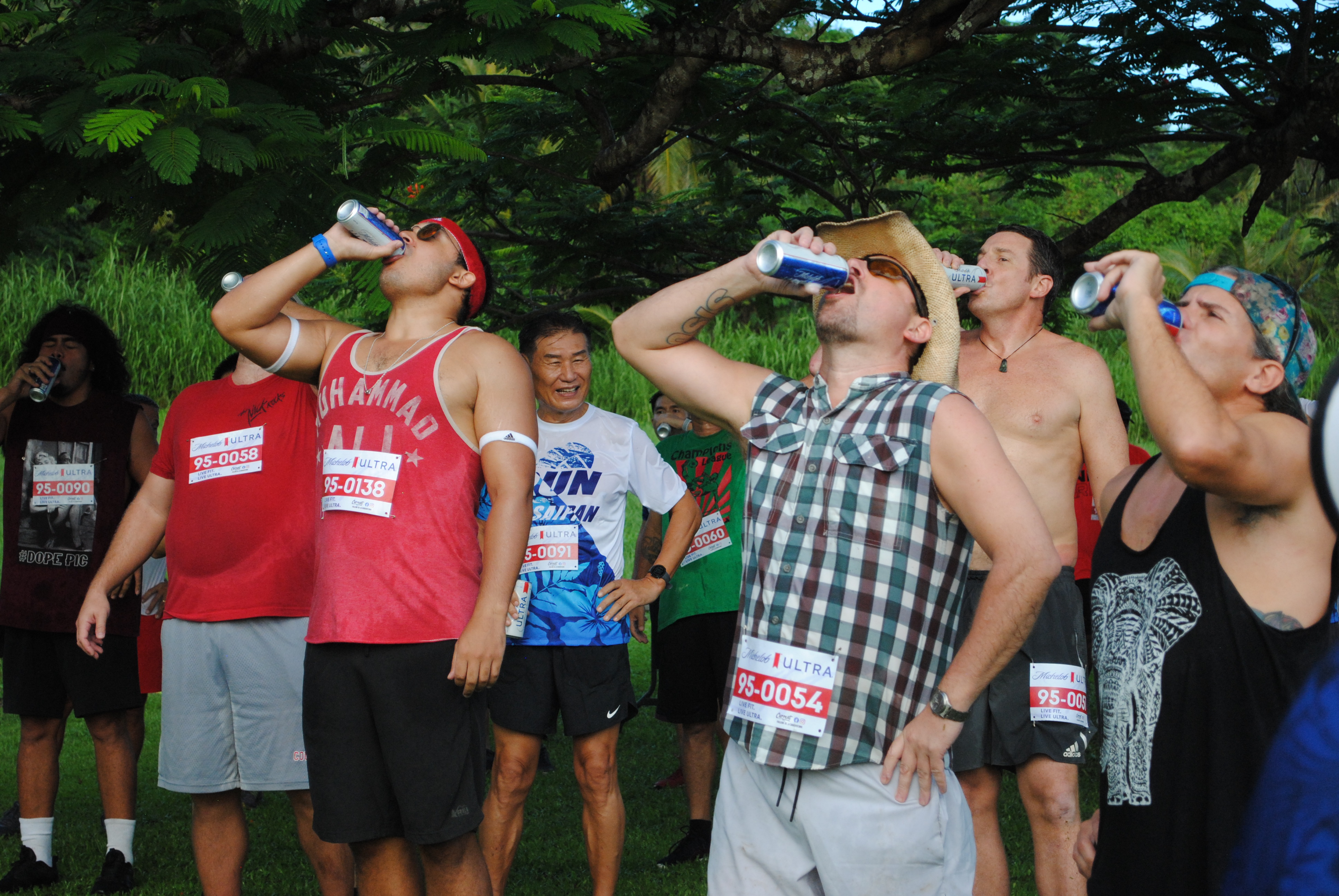 Participants gulp down Michelob Ultra during the 1st Michelob Ultra Beer Mile on Friday at Saipan Country Club.