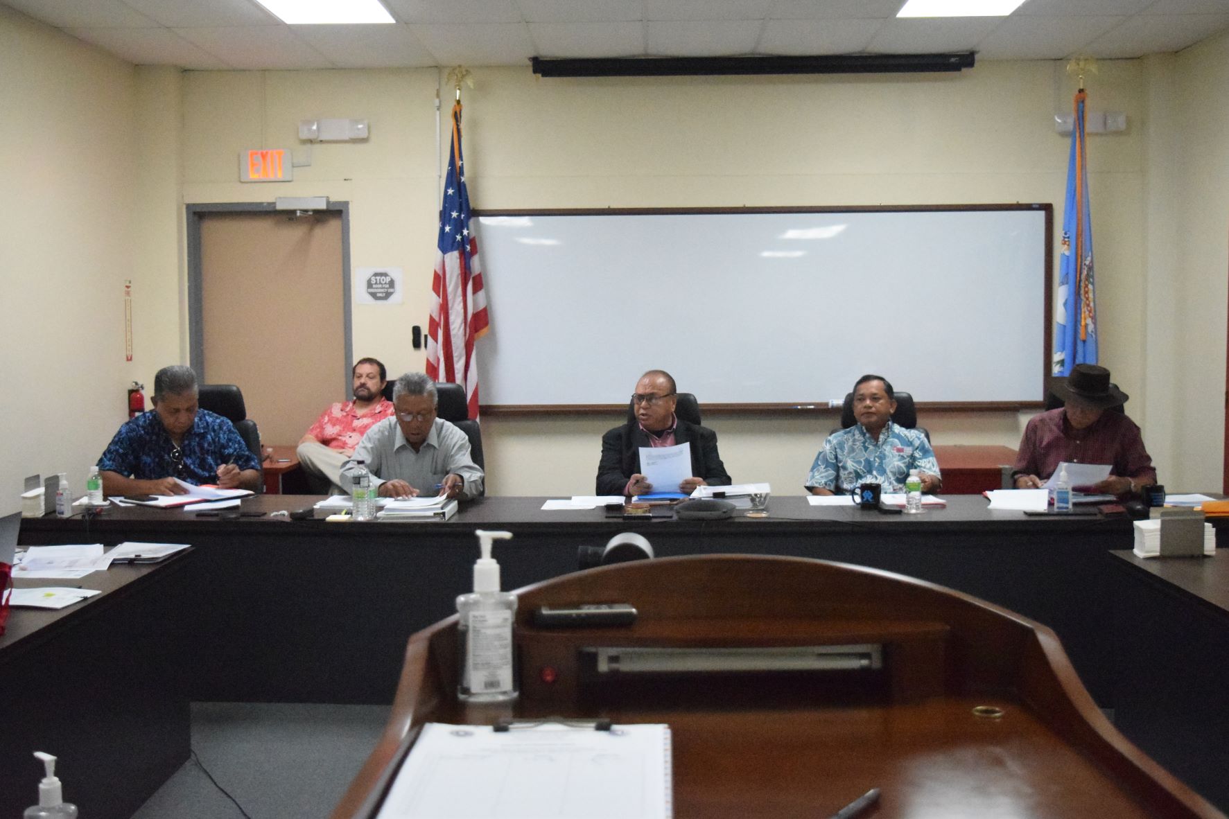 From left, front row, Commonwealth Casino Commissioners Martin Mendiola and  Mario Taitano, chairman Edward C. Deleon Guerrero, vice chairman Ralph Demapan and commissioner Ramon Dela Cruz, during a meeting Thursday in the commission's conference room at Springs Plaza in Gualo Rai. Behind them is IT manager Ian Morell.