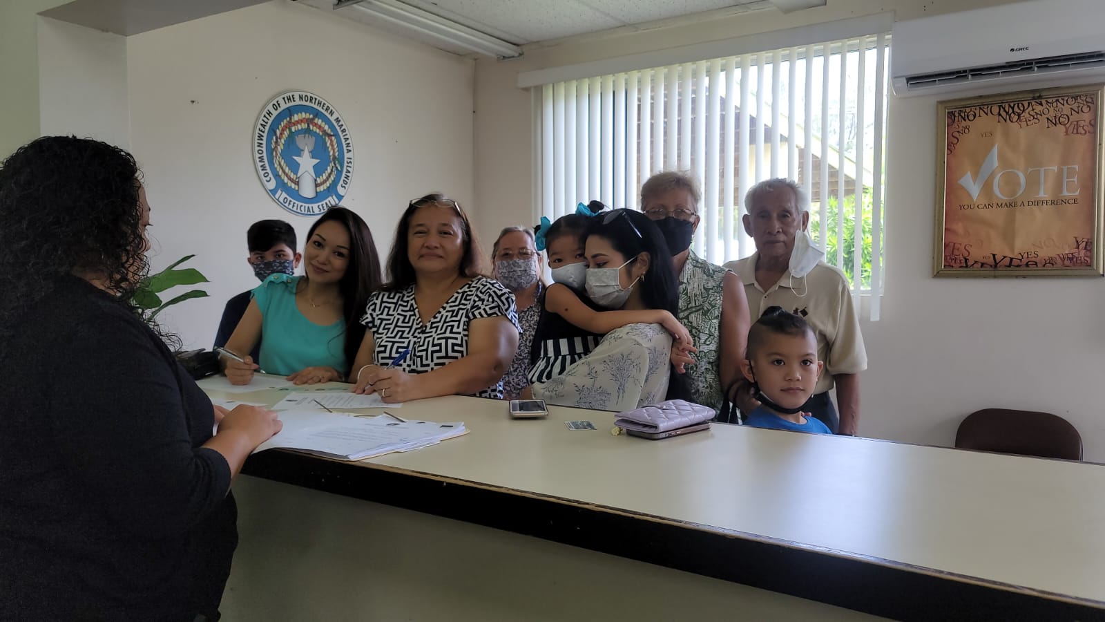Joining Carmen T. Cabrera Pangelinan, third left, at the Commonwealth Election Commission on Thursday are former Gov. Carlos S. Camacho, right, and wife, Winnie.  Also in photo are Cabrera’s grandson Ramon Garido Villagomez III, daughter and committee-to-elect chair Brenna C. Villagomez, Carmen's sister, Olinka Cabrera, daughter Tomiko Pangelinan who is carrying her niece Adaline Villagomez, and Carmen's nephew Isamu.