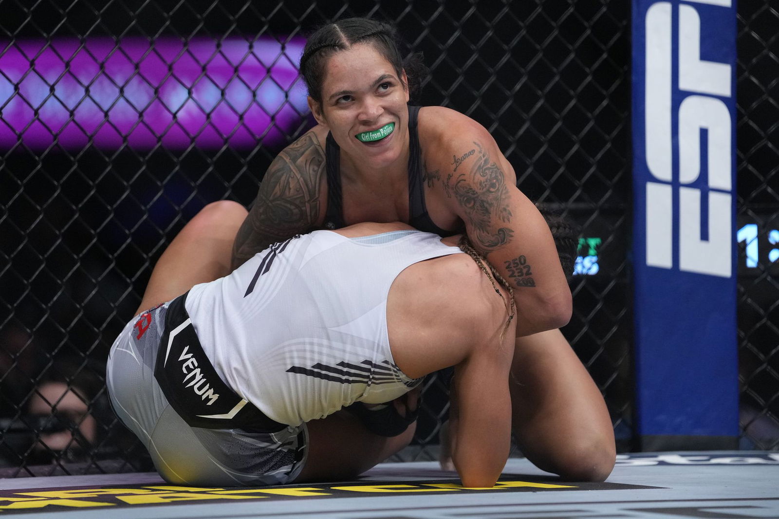 Amanda Nunes applies a hold against Julianna Pena during UFC 269 at T-Mobile Arena in Las Vegas, Nevada, Dec. 11, 2021.