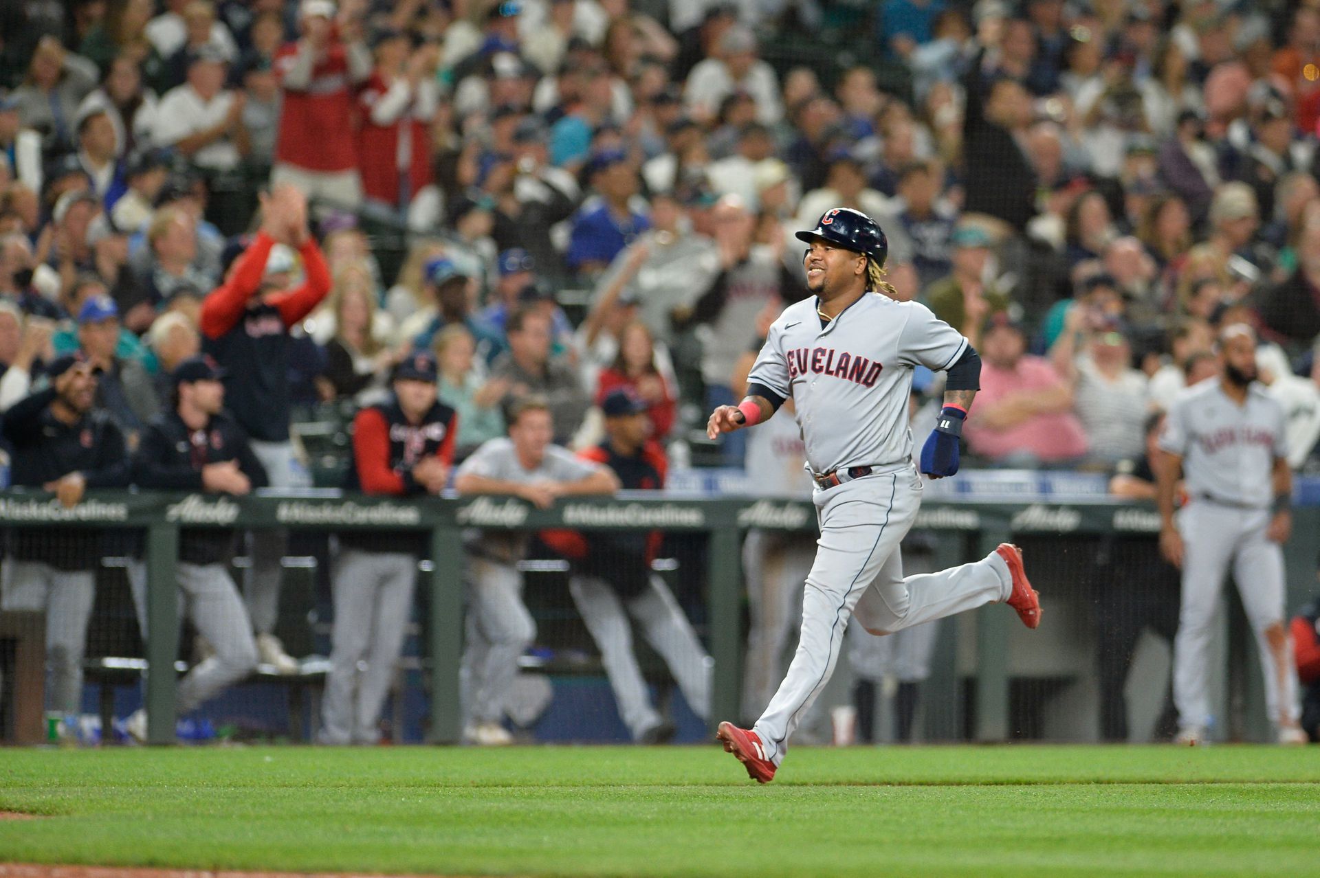 Cleveland Guardians third baseman Jose Ramirez (11) scores a run on a sacrifice fly hit by second baseman Andres Gimenez — not pictured — against the Seattle Mariners during the eighth inning at T-Mobile Park in Seattle, Washington, Aug. 27, 2022.