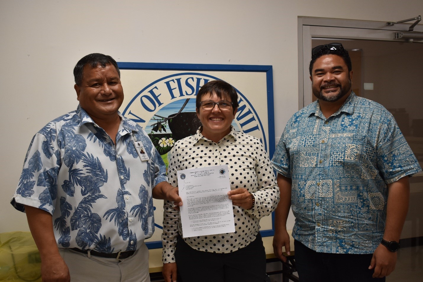From left, Division of Fish and Wildlife Director Manuel Pangelinan, U.S. Environmental Protection Agency Region 9 Additional Supplemental Appropriations for Disaster Relief Act Lead/Disaster Recovery Coordinator for the CNMI Michelle Baker, and Office of Planning and Development Director A. Kodep Ogumoro-Uludong pose for a photo after DFW issued a conditional permit for the Marpi Landfill Cell 2 rehabilitation project.