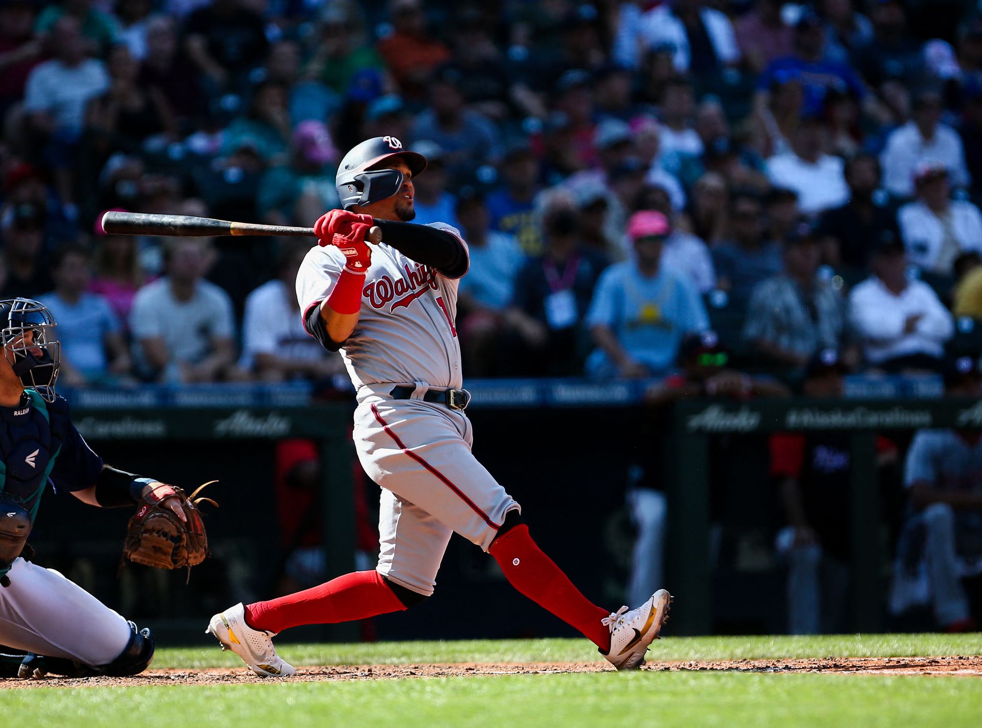 Washington Nationals third baseman Ildemaro Vargas (14) hits a two run home run against the Seattle Mariners during the ninth inning at T-Mobile Park. In Seattle, Washington, Aug. 24, 2022.