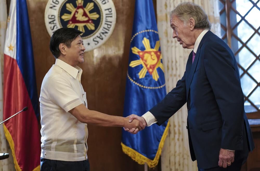 In this photo provided by the Malacañang Presidential Photographers Division, Philippine President Philippine President Ferdinand Marcos Jr., left, greets U.S. Sen. Edward Markey during the lawmaker’s courtesy call at the Malacañang presidential palace in Manila, the Philippines on Thursday Aug. 18, 2022.