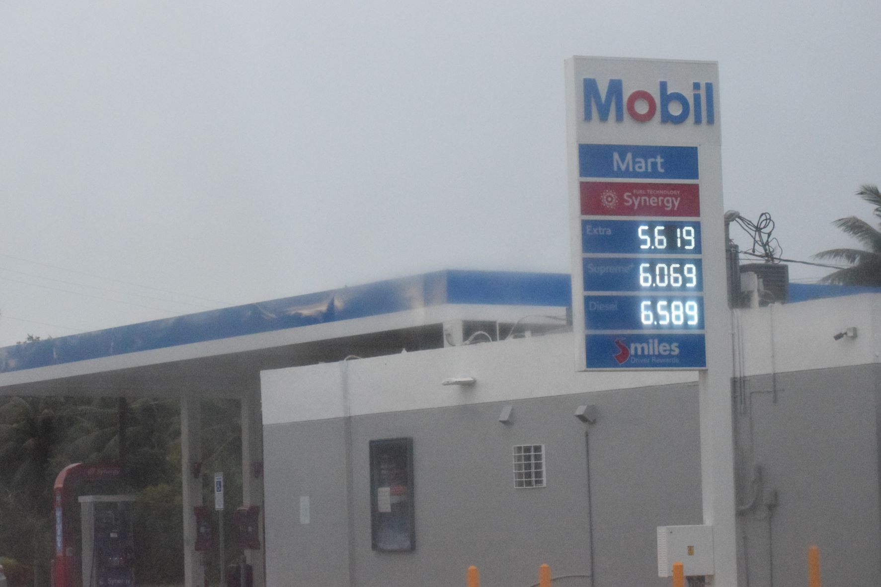 The Mobil Oil station in Chalan Kiya displays its new prices on Friday.