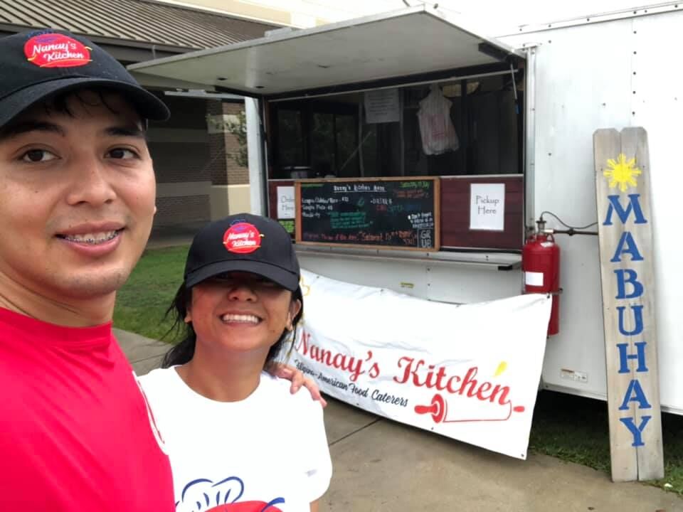 Timothy and Aderwyn Jade Graybeal take a selfie in front of their former food truck in Mississippi.