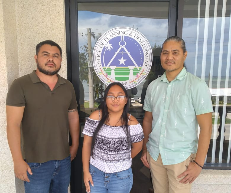 Office of Planning and Development intern Magdalen Santos, center, with her two mentors, planner Manuel Camacho and project manager Leonard Leon, at OPD’s main office in Oleai.
