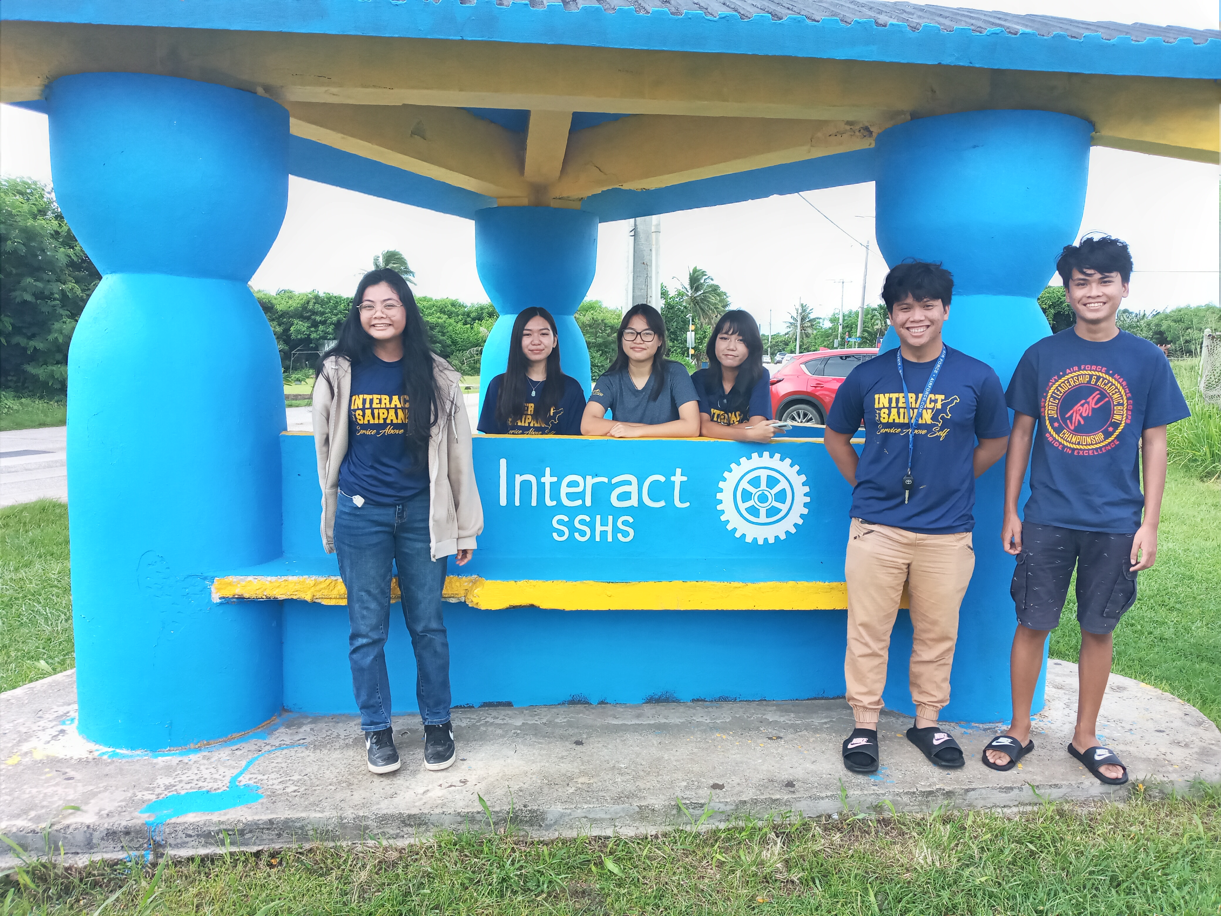 Interact Club of Saipan Southern High School members pose for a photo at the Dandan bus shelter that they repainted and cleaned up.