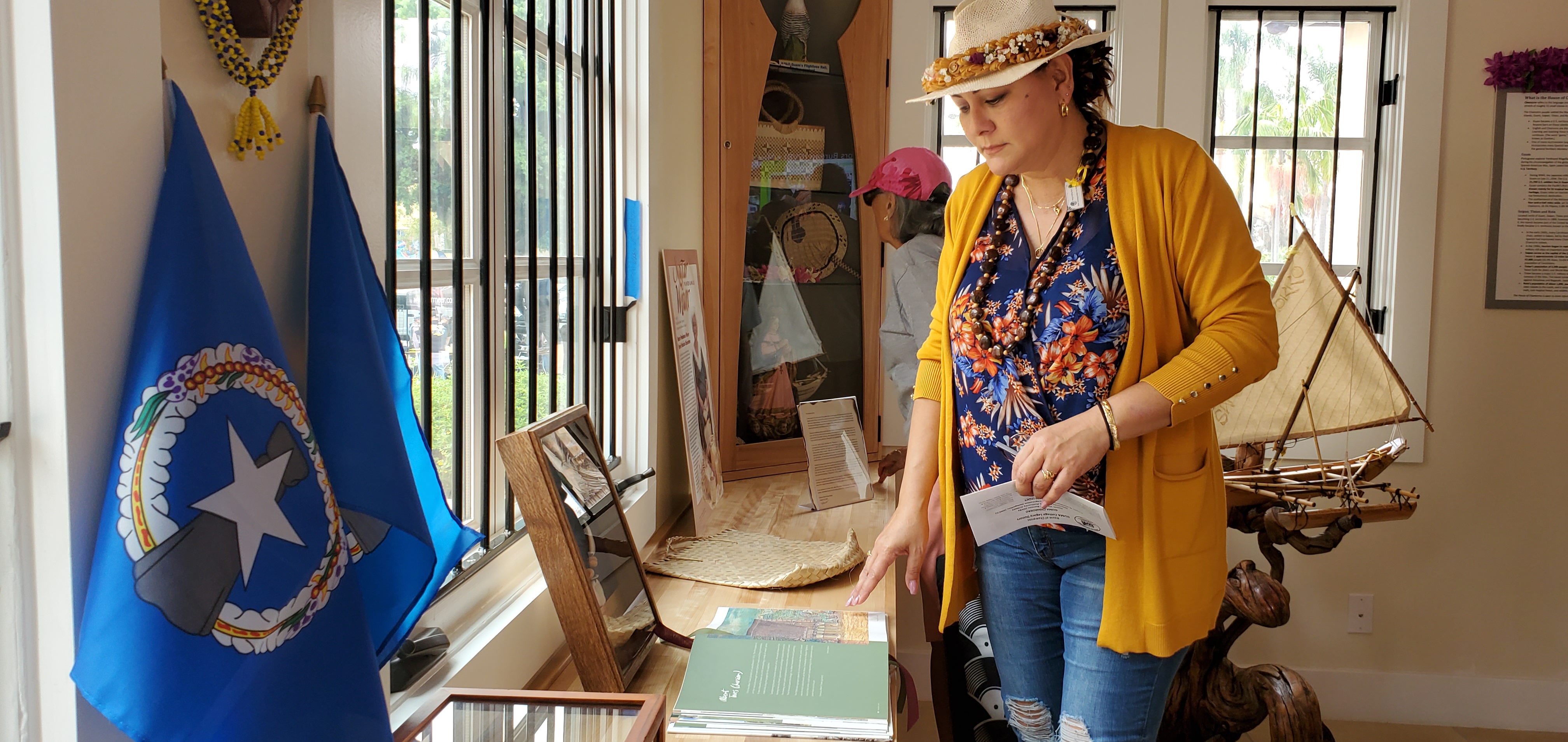 Hafa Adai Festival Volunteer Jennifer White-Aguon looks at some of the items being displayed inside the newly opened House of Chamorros in San Diego’s Balboa Park.