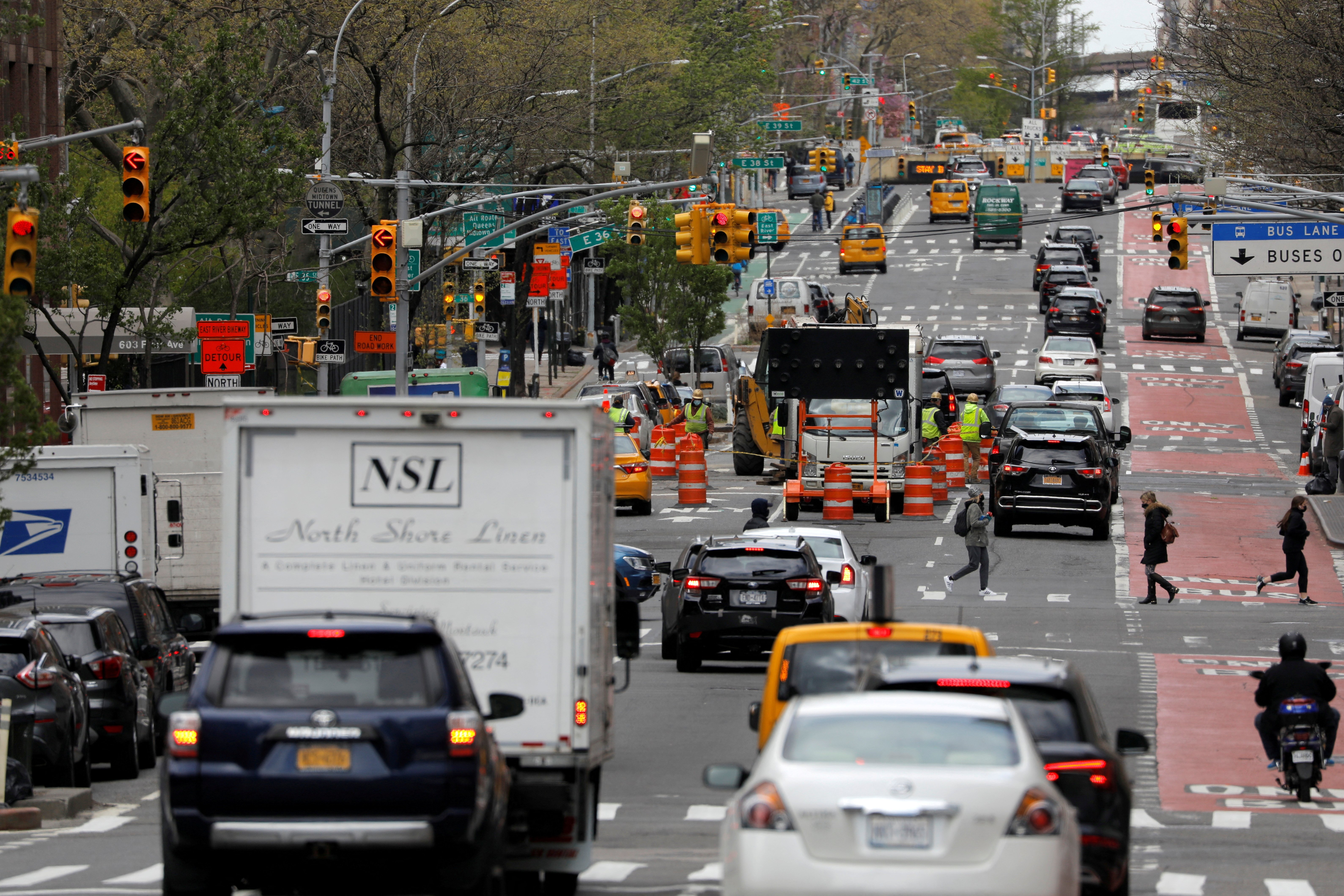 Traffic travels on First Avenue in Manhattan, New York City, New York, April 22, 2021.