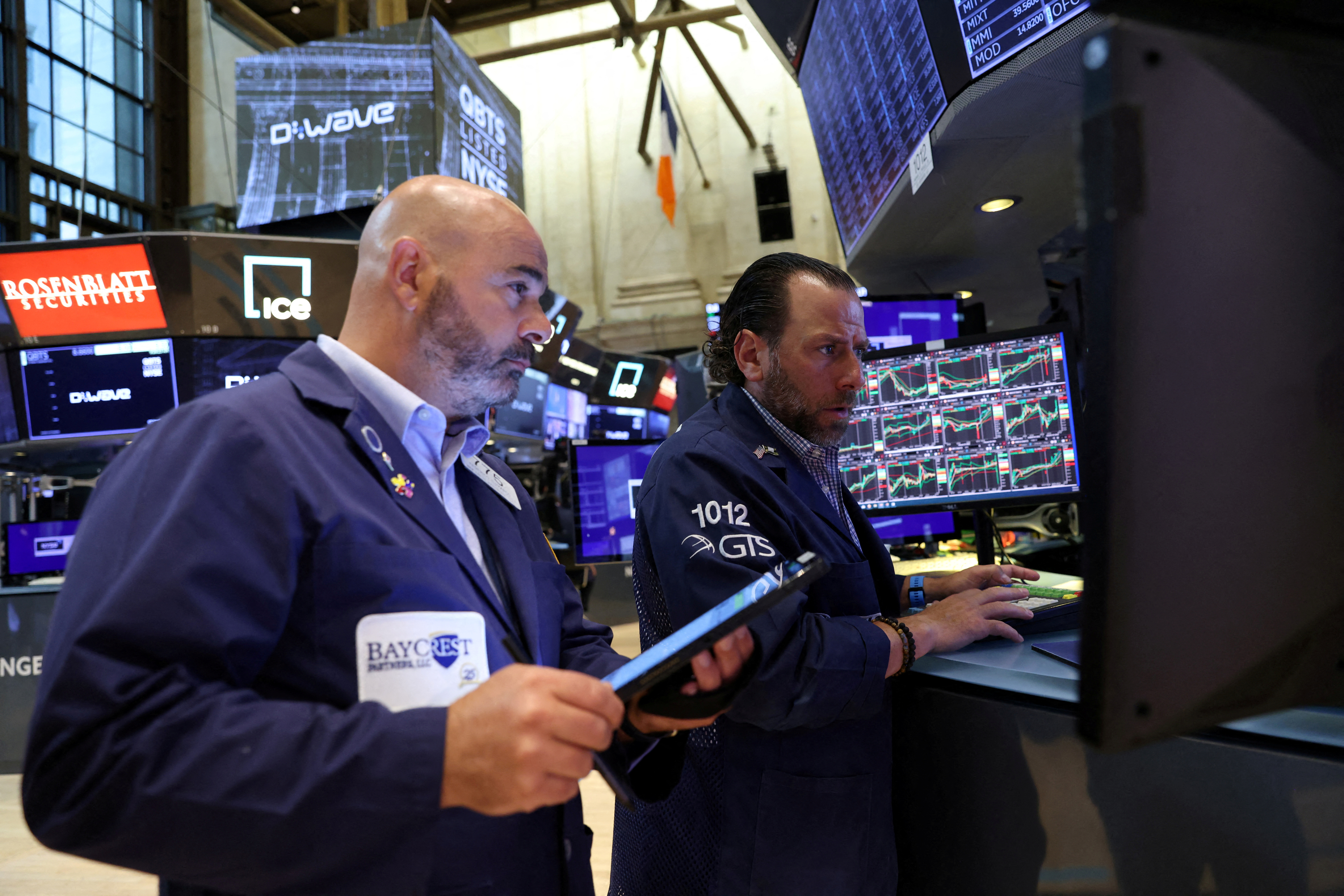 Traders work on the trading floor at the New York Stock Exchange in Manhattan, New York City, Aug. 8, 2022.