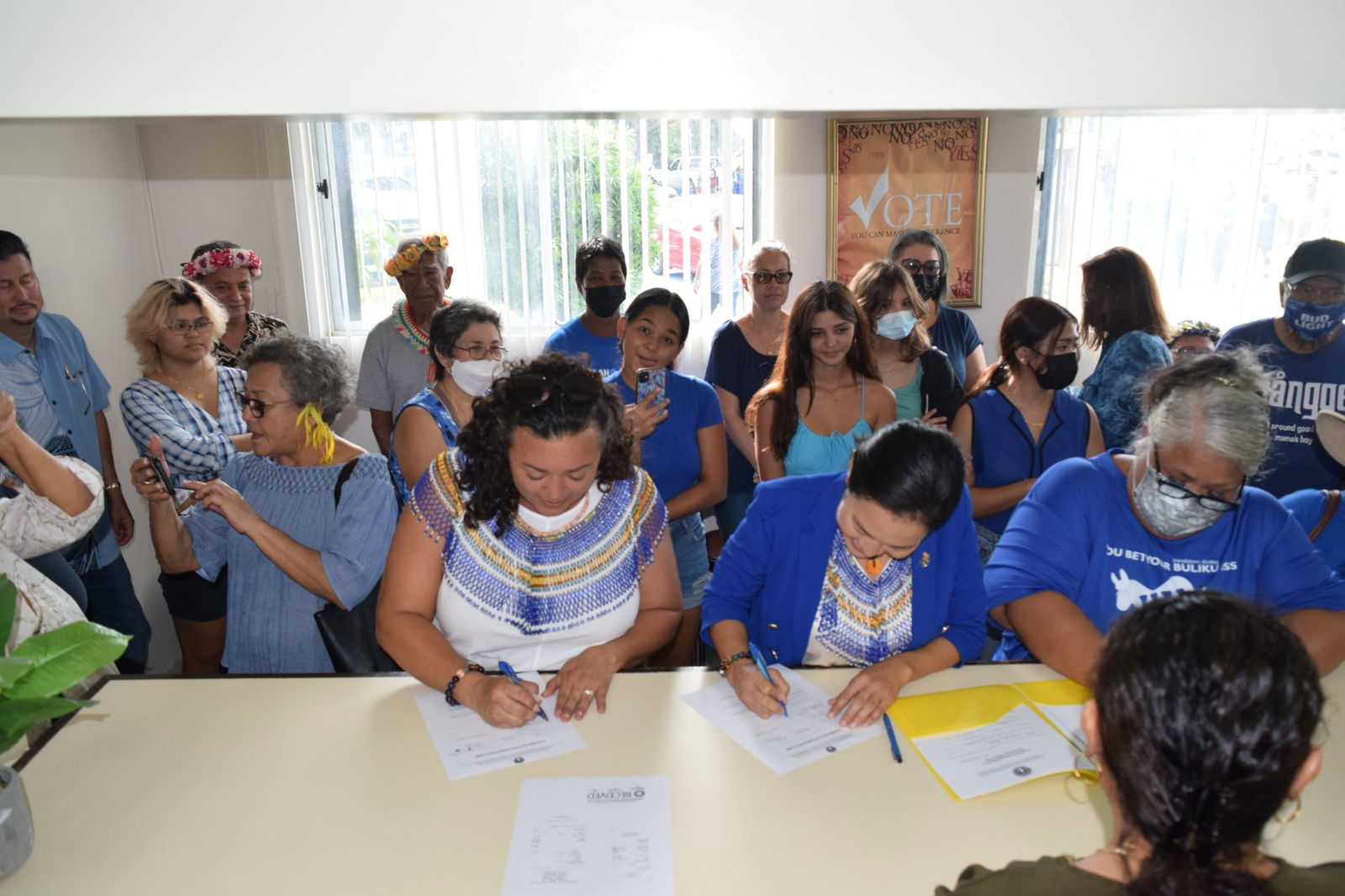 With family members and other supporters, NMI Democratic Party gubernatorial candidate Rep. Tina Sablan, second right, and her running mate, Rep. Leila Haveia Fleming Staffler, center, file their candidacies Friday at the Commonwealth Election Commission.