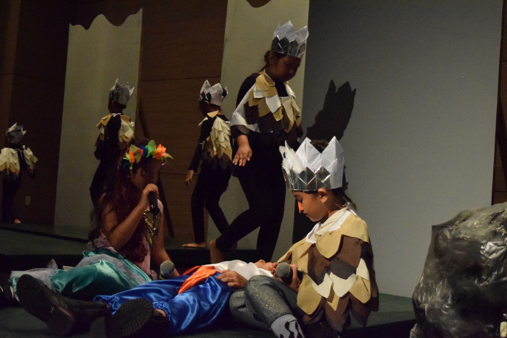 Ariel and Sucttle attend to an ailing Prince Eric as sea gulls fly by.