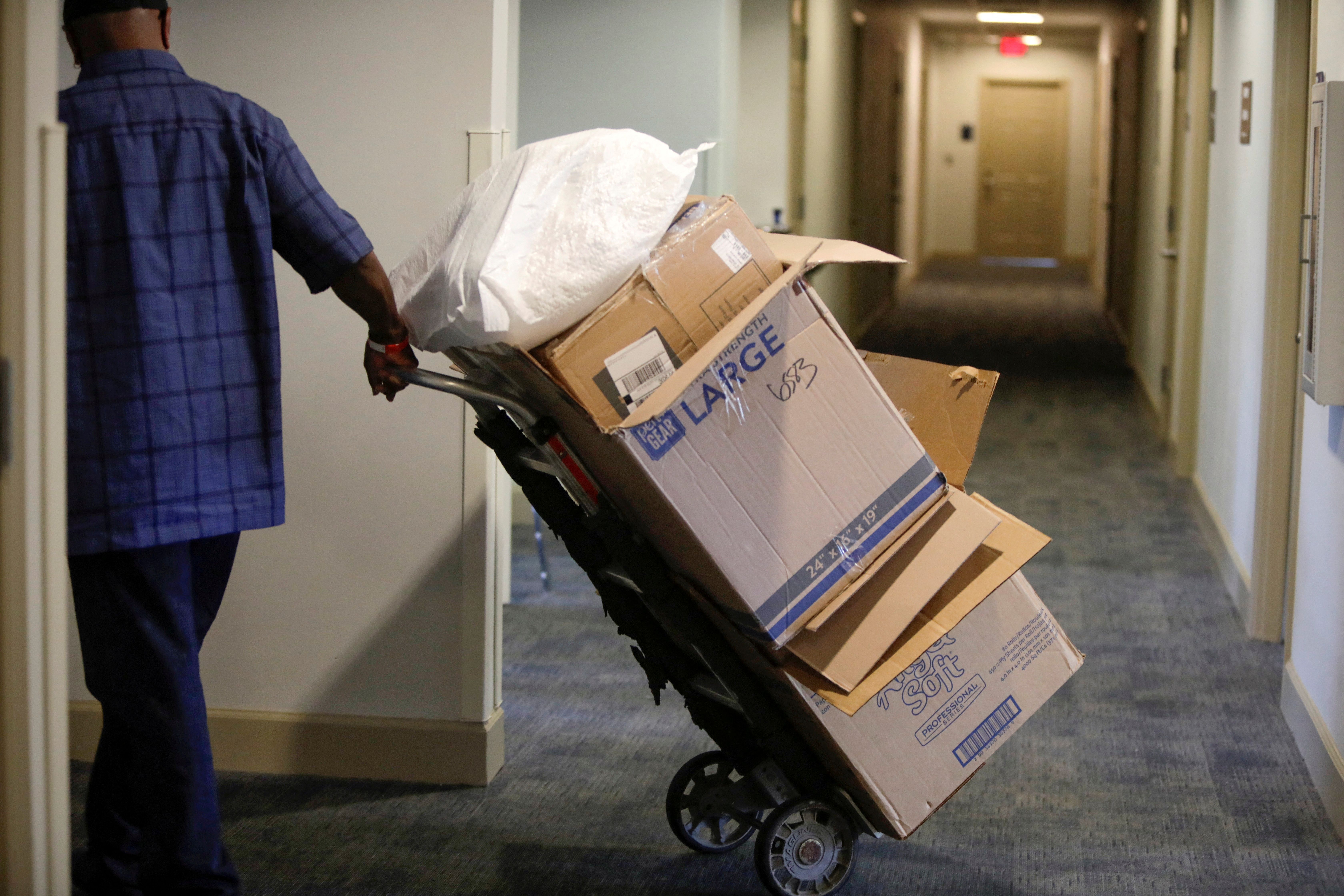 Empty boxes are taken out during move in day as Bennett College students return to campus for the first time since the HBCU Liberal Arts College went remote to prevent the spread of the coronavirus disease in March 2020, in Greensboro, North Carolina, Aug. 30, 2021.