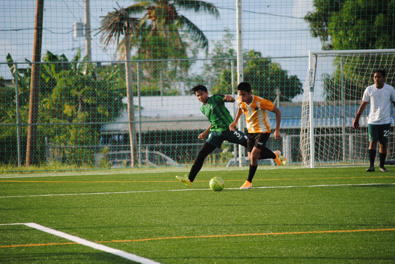 Kanoa FC's Leland Deleon Guerrero steals the ball off a Tan Holdings player.