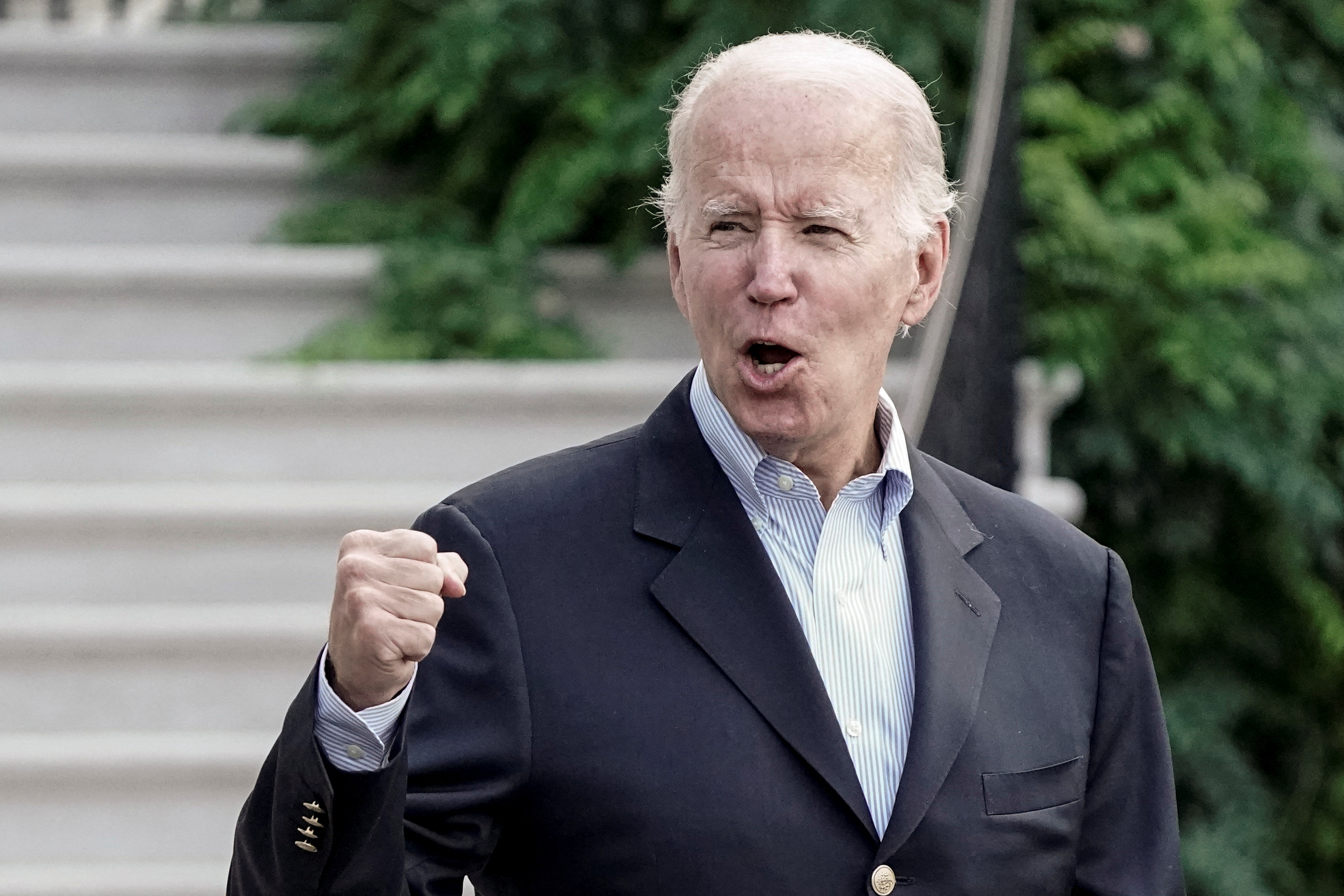 President Joe Biden gestures to the media as he walks toward Marine One for departure to Rehoboth Beach, Delaware from the South Lawn of the White House in Washington, D.C., Aug. 7, 2022.
