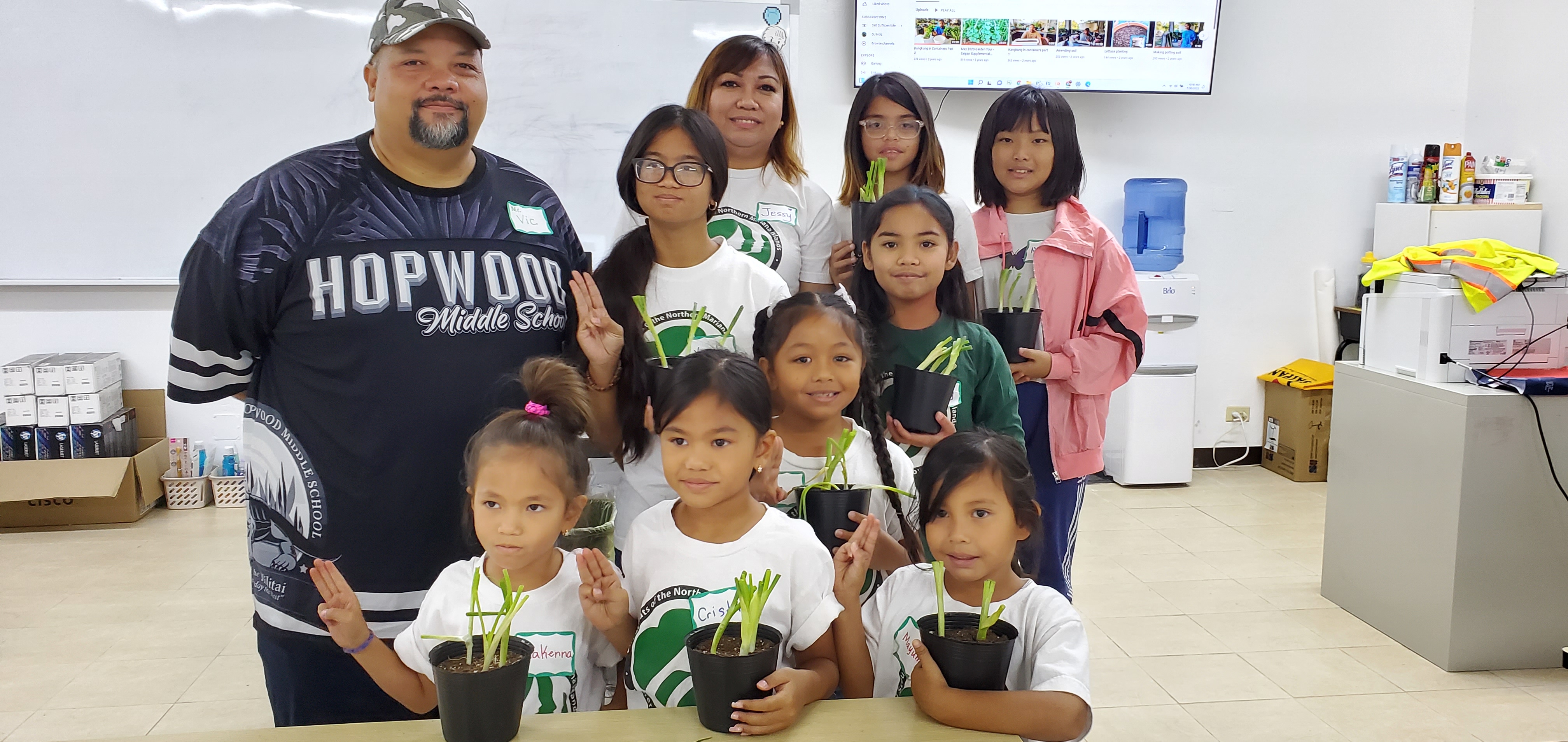 NMI Girl Scouts show their pledges and new plants after a workshop with Career Technical Education instructor Victor Cabrera and NMI Girl Scout Troop Leader Jessy Loomis.