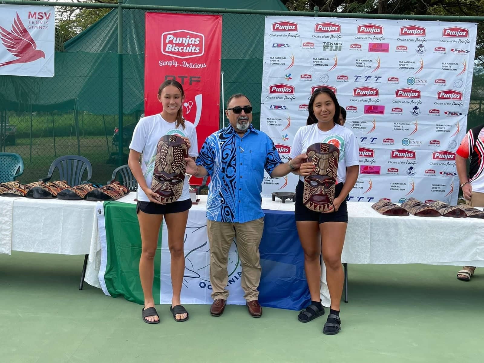Hyejin Elliott and Isabel Heras pose with their second-place trophies in the 2022 Pacific Nations Cup on Aug. 6 at the National Tennis Centre in Nadovu, Lautoka, Fiji.