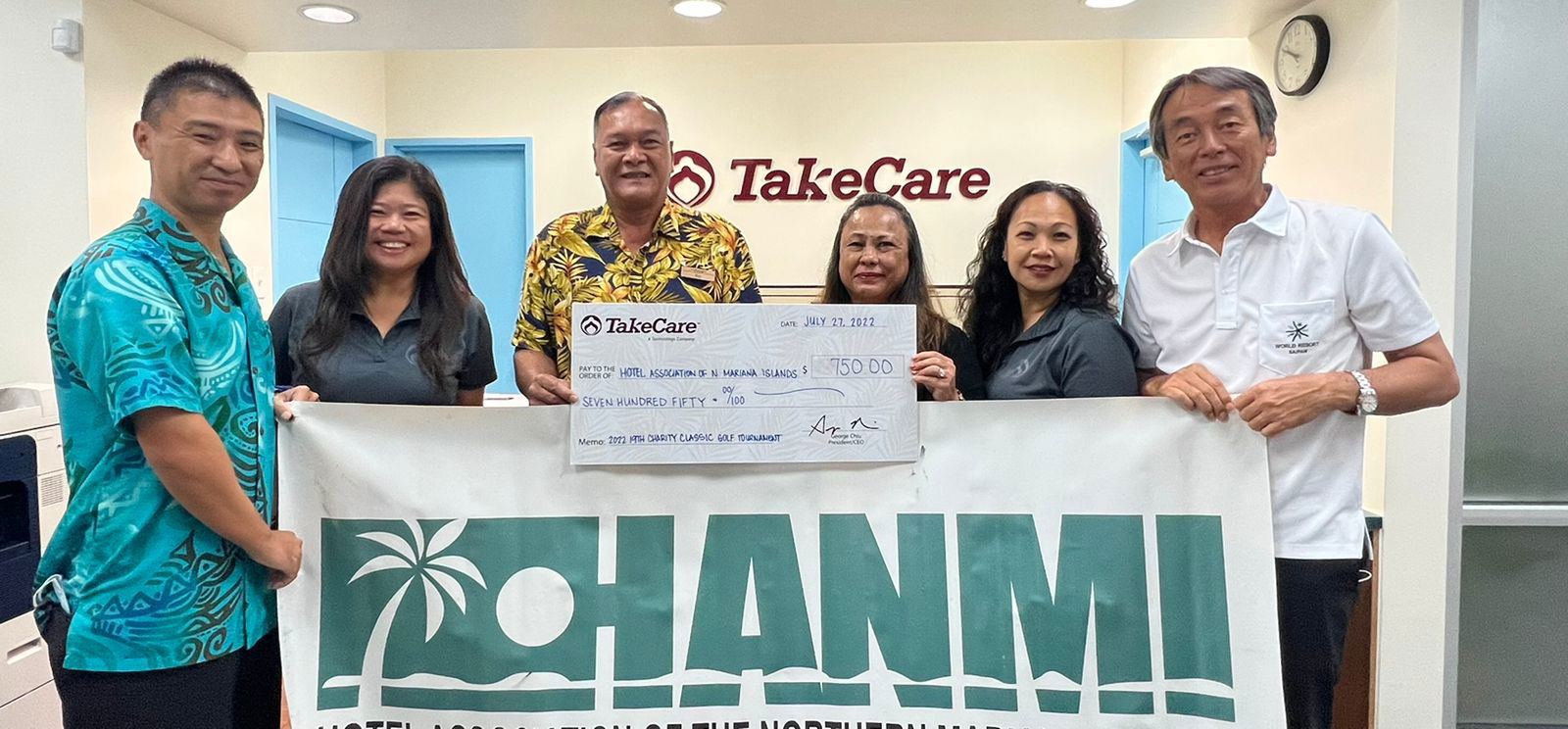 TakeCare Insurance Medical Coordinator Melanie Santos, third right, signs on as a Superior sponsor  for the 20th Annual HANMI Charity Classic Golf Tournament slated for Sept. 17, 2022, at LaoLao Bay Golf & Resort. From left, golf tournament committee member  Isao  Usui,  Santos,  committee member Max Concepcion, Health Plan Manager Nora Fejeran, Administrative Assistant Leilani Pangelinan, and tournament committee chairman Juko Ishikawa.  The donation was made on July 27, 2022, at the TakeCare Insurance office in Garapan, Saipan.