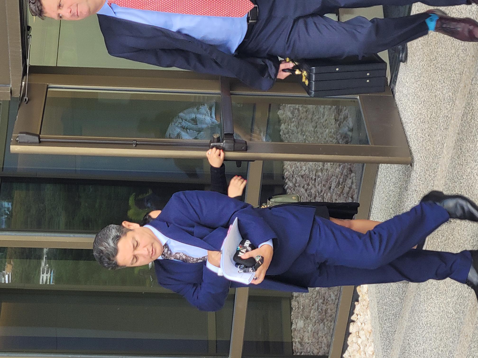 The governor's chief of staff, William M. Castro, left, exits the federal courthouse with his attorney Colin Thompson.