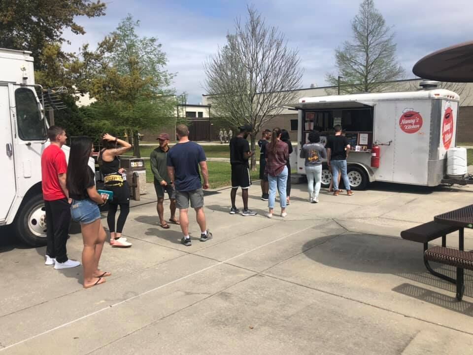 Customers line up in front of the Nanay's Kitchen food truck in Mississippi.