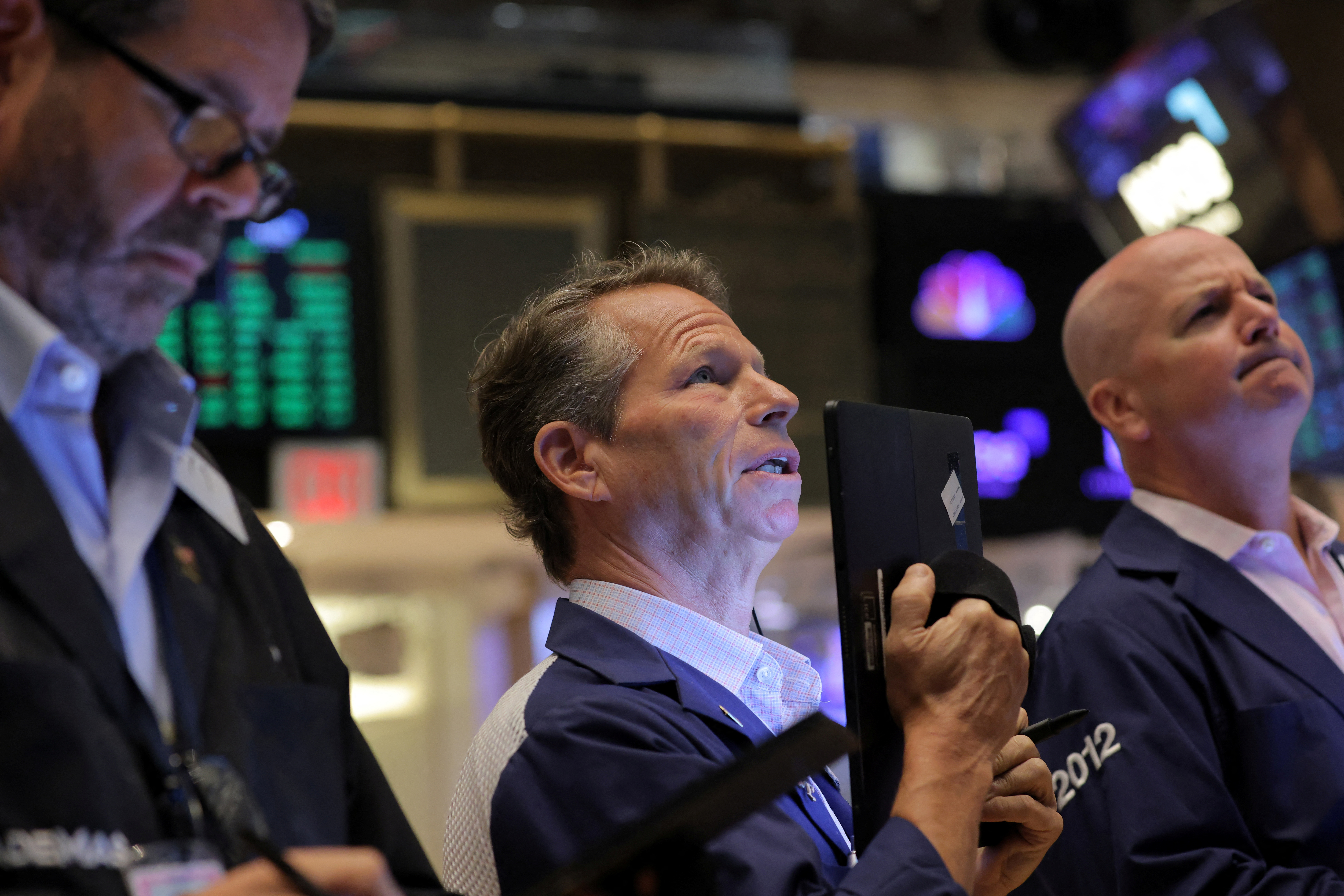 Traders work on the trading floor at the New York Stock Exchange in Manhattan, New York City, Aug. 8, 2022.