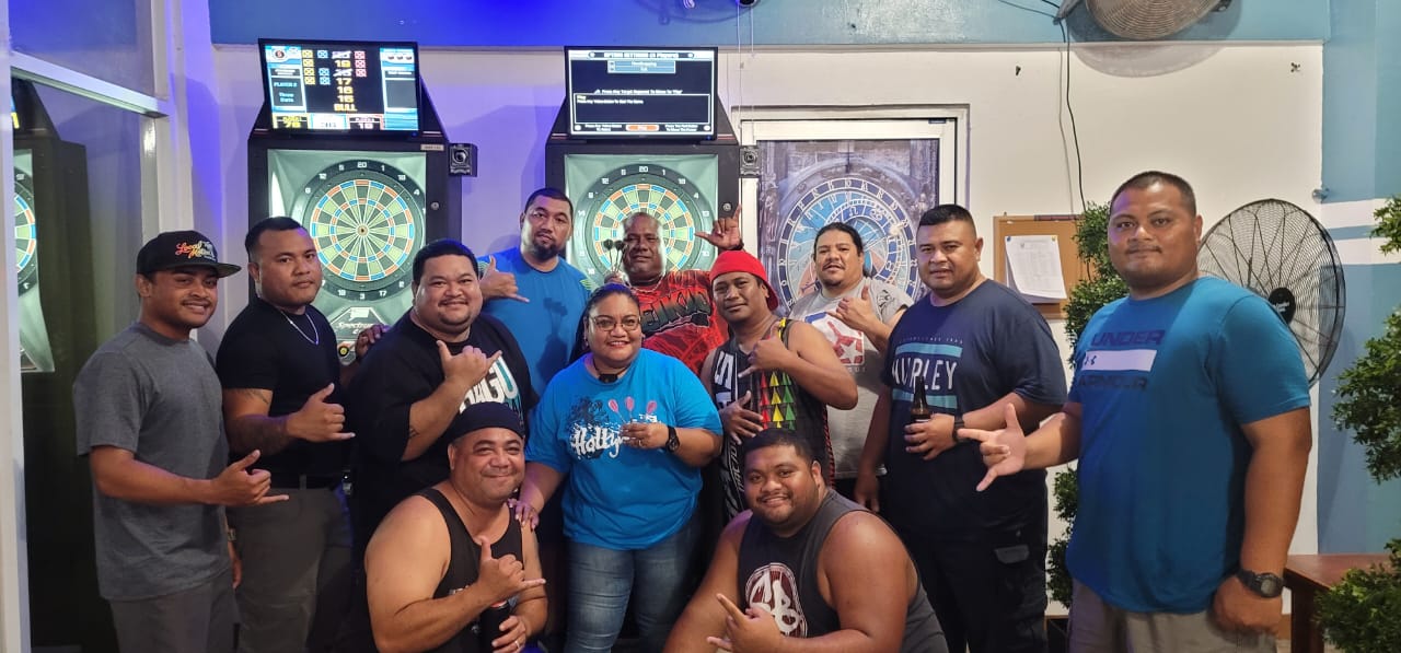 No Fear and Labwoogh pose for a photo after their match Thursday in the Flame Tree Thursday “B” Division of the SEDA Bud Light Dart League at Rendezvous.