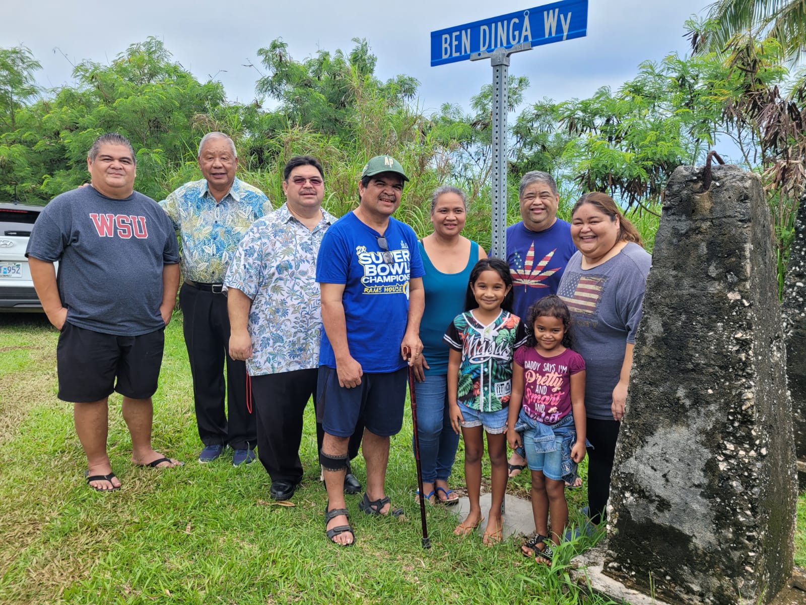 From left, former Rep. George N. Camacho, Saipan Mayor David M. Apatang, Associate Judge Joseph N. Camacho, Isidoru Camacho, his wife Melissa, daughter Chela and a niece, former Rep. Claudio Norita, and Loling Camacho stand next to the street sign that honors the late Vicente "Ben Dinga" Tudela Camacho.