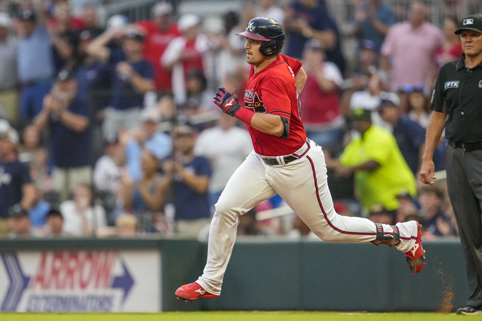 Atlanta Braves third baseman Austin Riley (27) runs after hitting a double against the Arizona Diamondbacks during the third inning at Truist Park in Cumberland, Georgia, July 29, 2022.