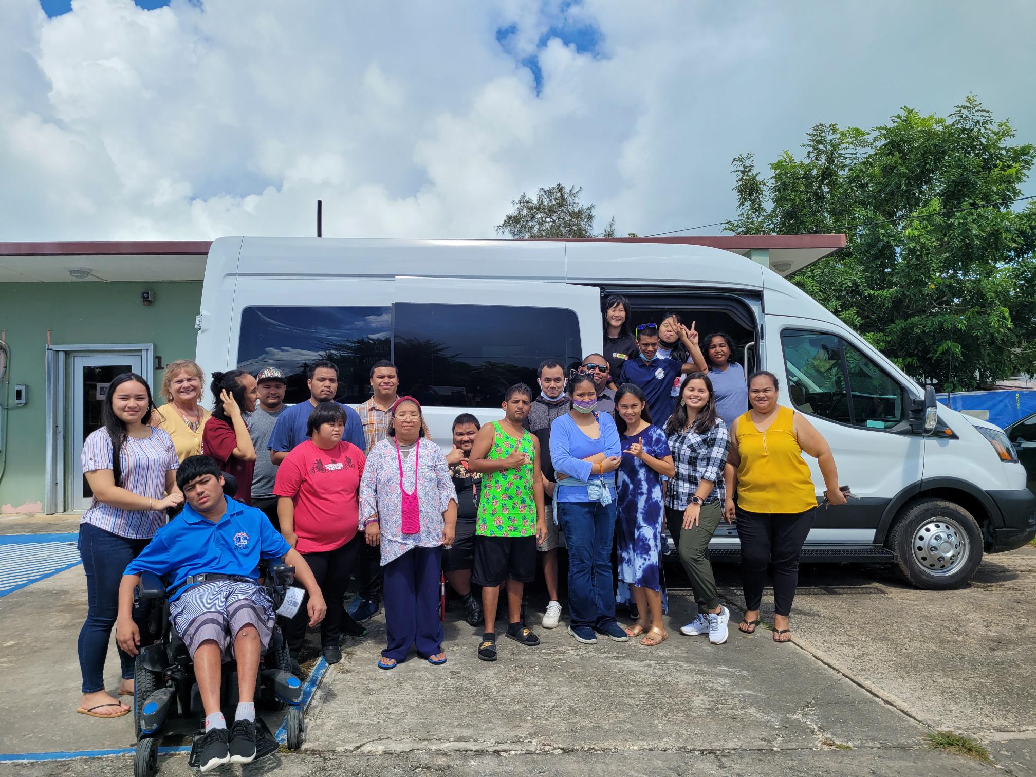 Center for Living Independently-CNMI Executive Director Susan Satur with staffers  Matilde Selepeo, Zack Peter, Devonne Sablan and Tiana Pellegrino pose beside a newly purchased van. Also in photo are some of CLI’s consumers.
