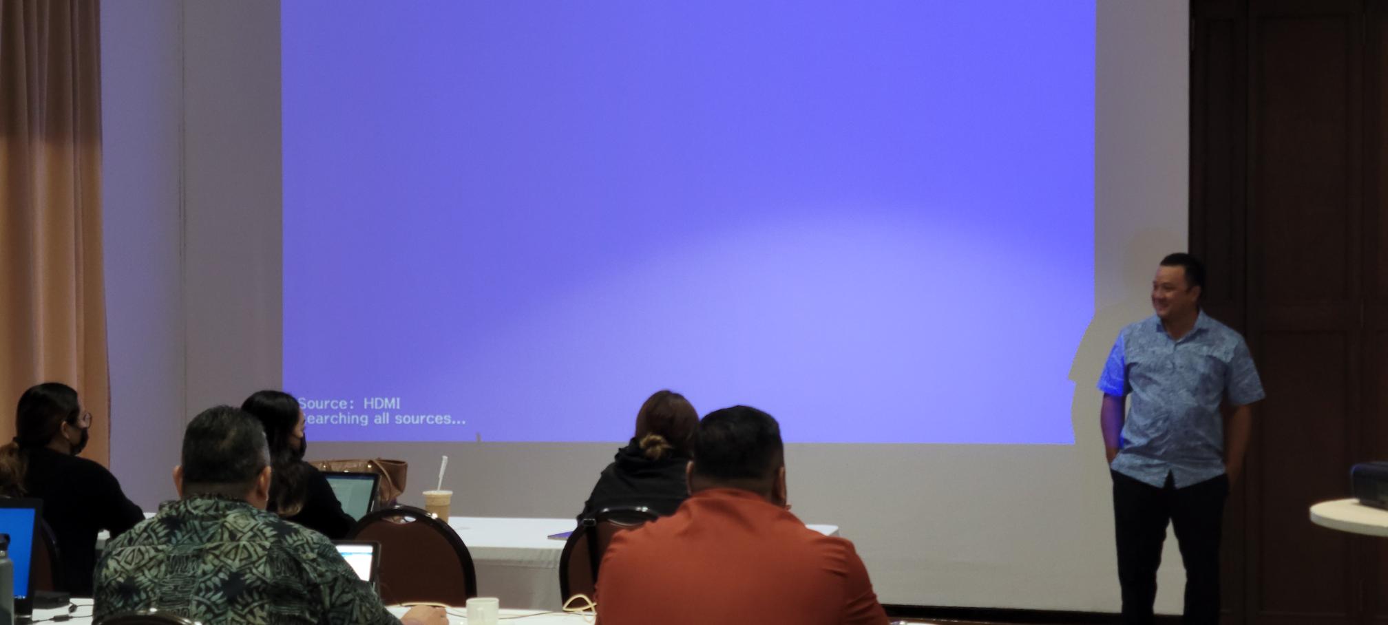 Patrick Guerrero, right, delivers his remarks to the Public Assistance Office staff on Tuesday. Guerrero heads the PAO and serves as the governor's authorized representative for the Covid-19 disaster.