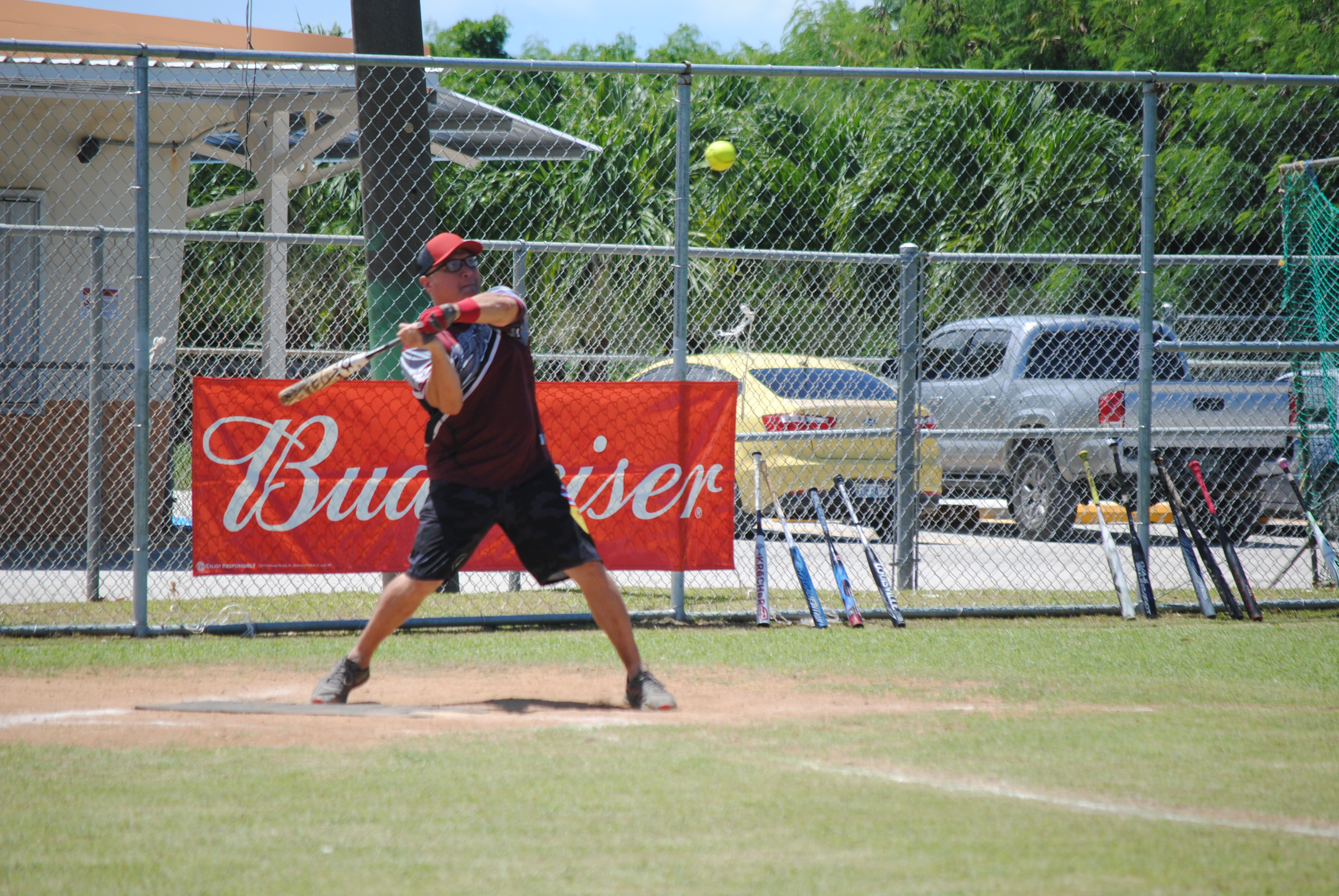 SUFA's Jude Dickenson is about to hit a homerun during a 2022 Budweiser Belau Amateur Softball League game Sunday at the Dandan baseball field.